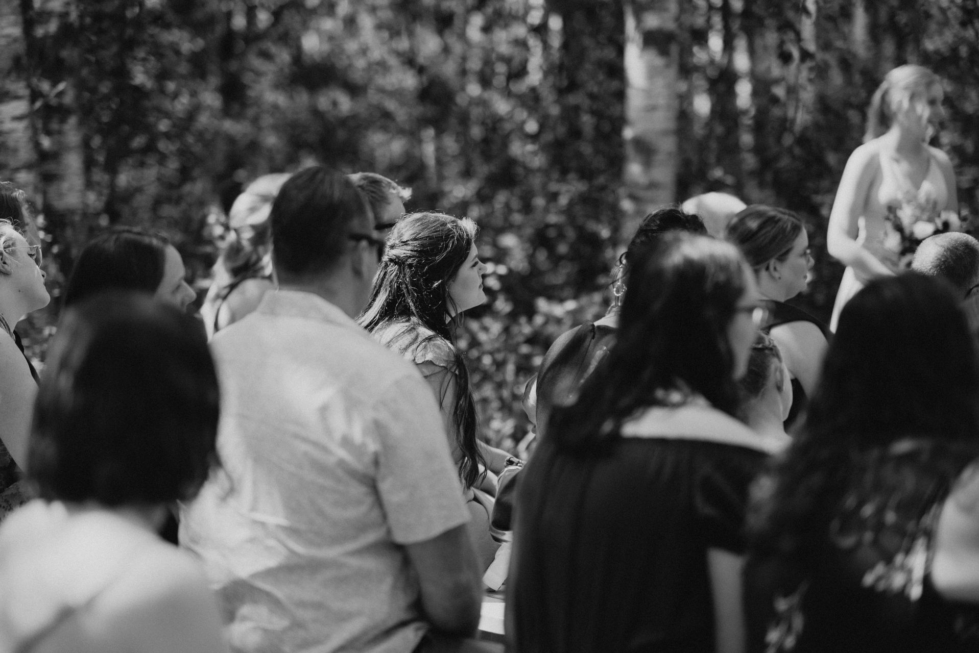 Black and white documentary of the congregation at the birch forest ceremony — Deer Meadow Farm Manitoba