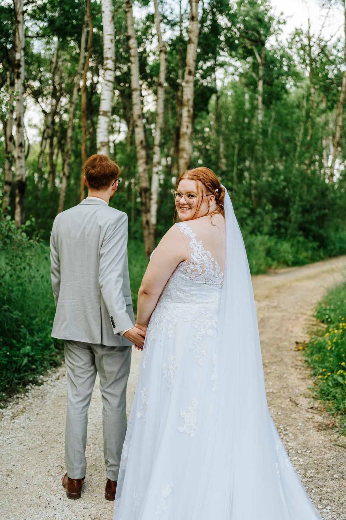 Couple portrait embracing amongst the birch trees at Deer Meadow Farm Manitoba — Ngo Photography