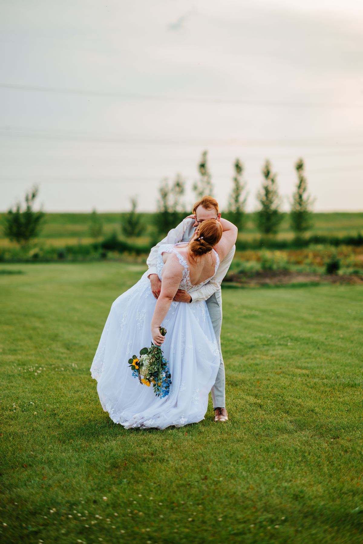 Couple portrait at sunset in the fields at Deer Meadow Farm Manitoba — Ngo Photography Winnipeg