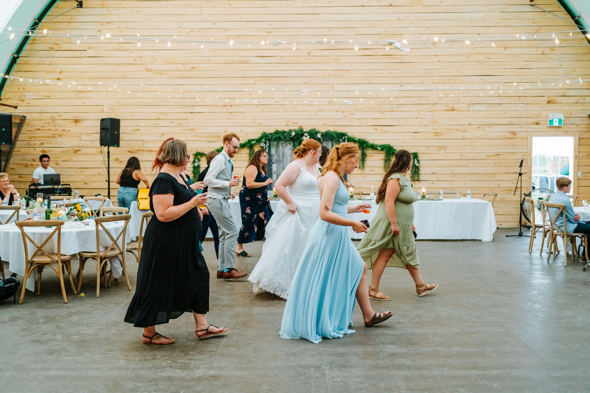 Reception dancing in the quonset barn at Deer Meadow Farm Manitoba — wedding photography by Ngo Photography