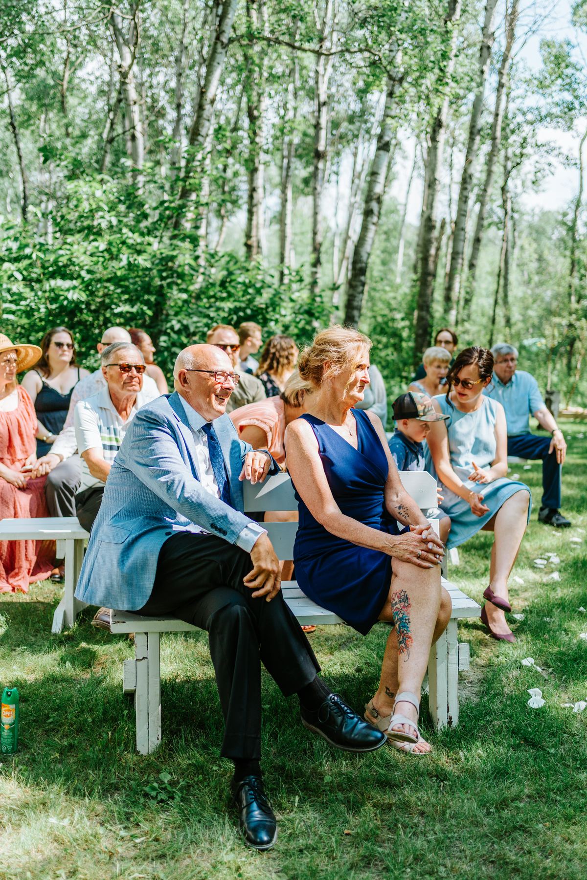 Groom Josh waiting at the handmade log arbor in the birch forest — Deer Meadow Farm Manitoba wedding photographer