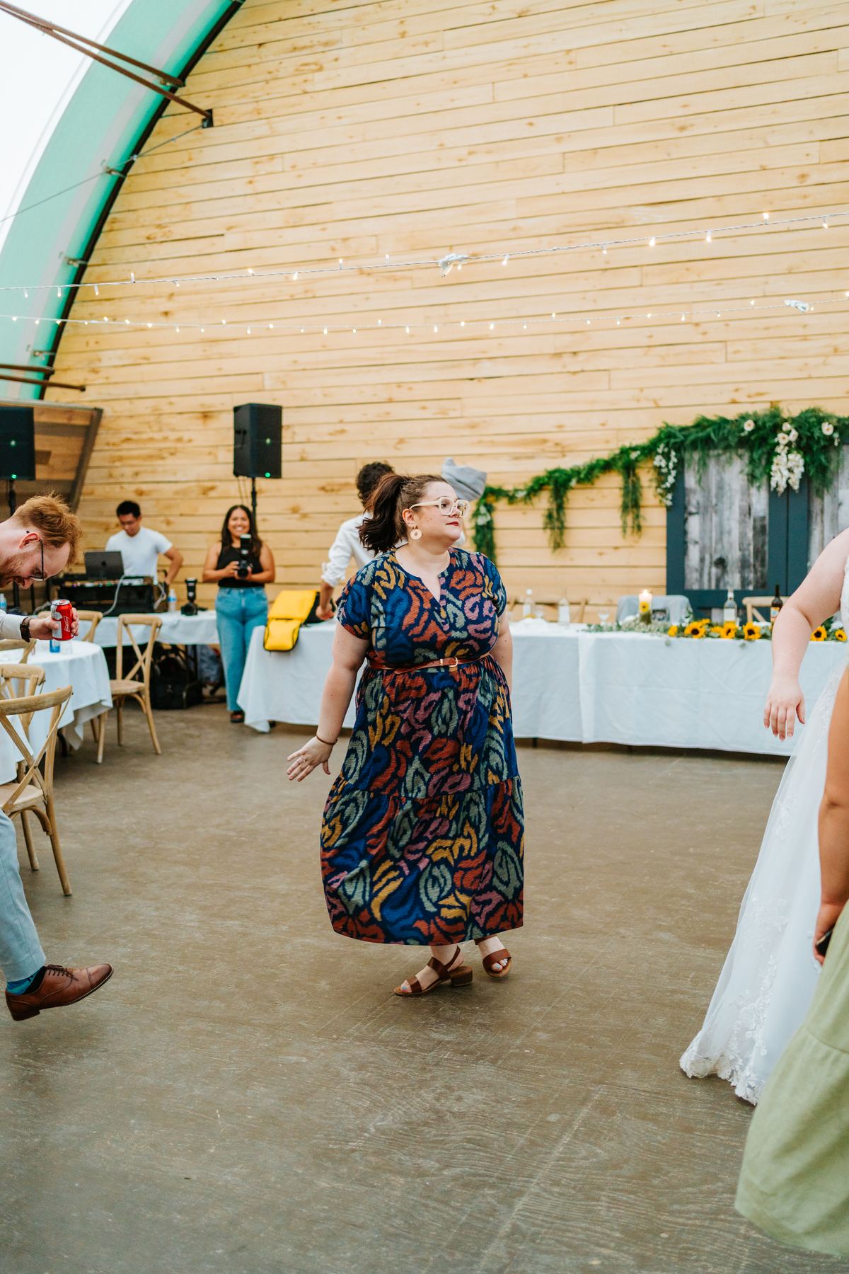 Guests and wedding party on the dance floor in the quonset barn at Deer Meadow Farm Manitoba — Ngo Photography