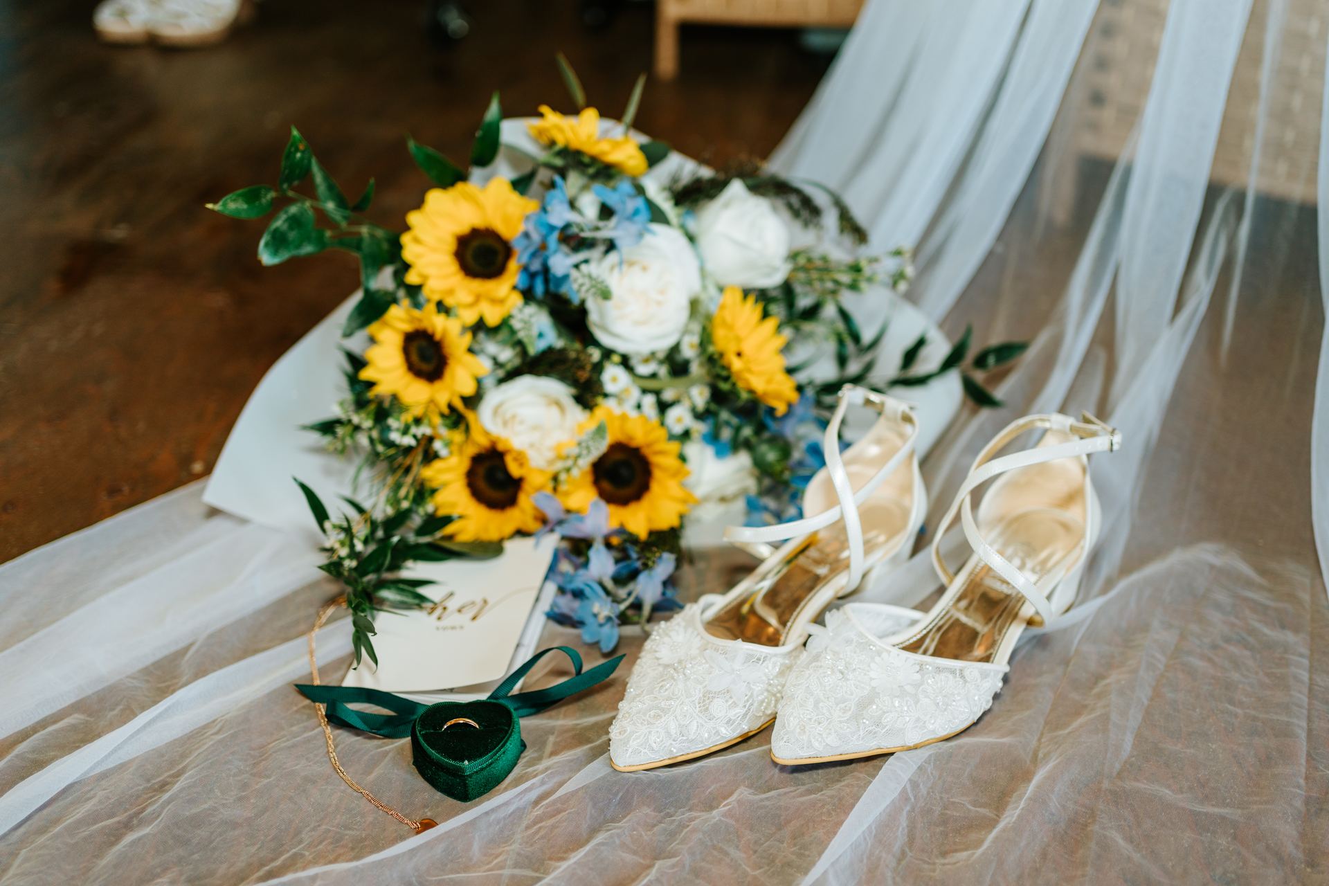Sunflower and powder blue wedding bouquet with bridal shoes and ring details — Deer Meadow Farm Manitoba wedding