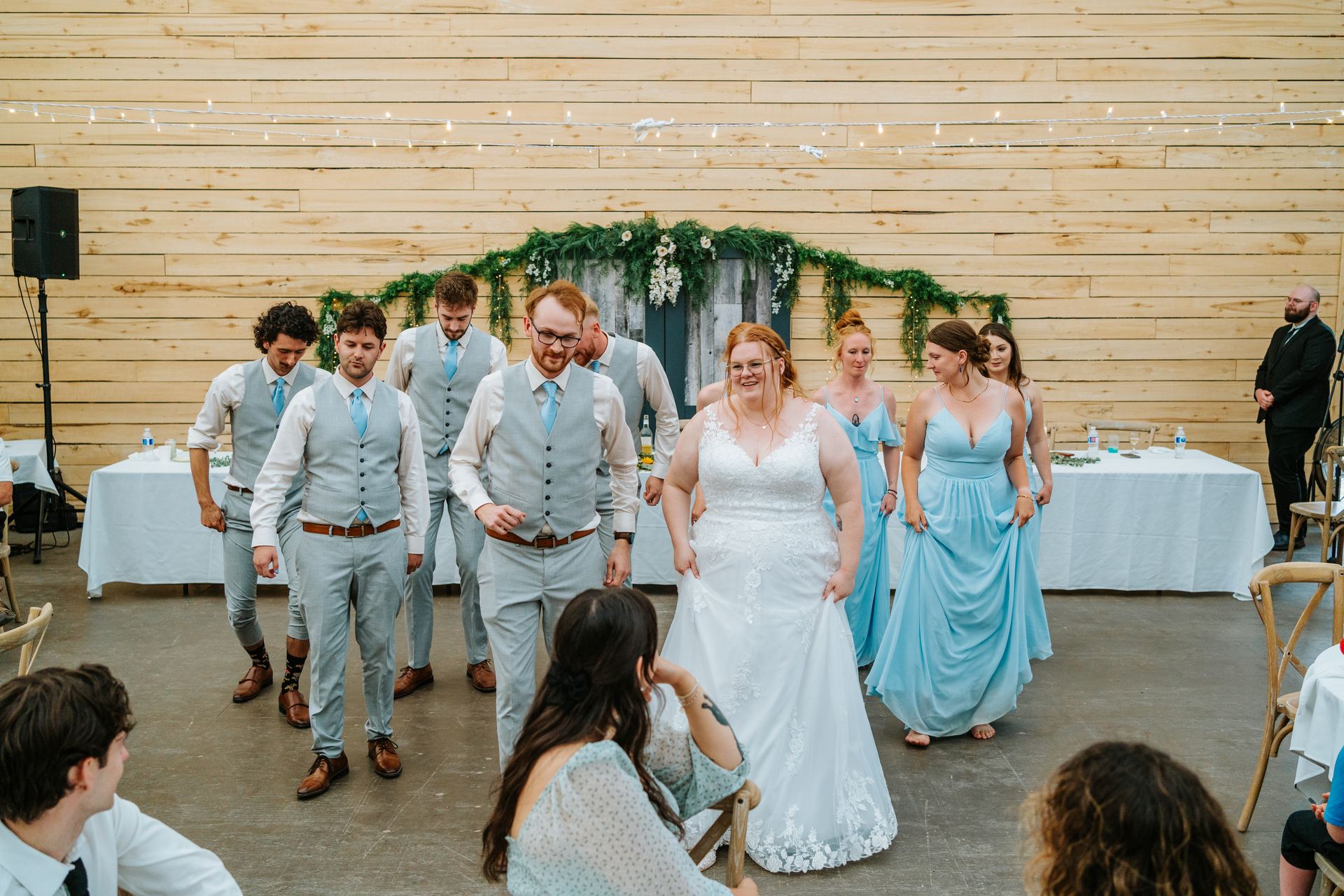 Wedding party grand entrance into the quonset barn at Deer Meadow Farm Manitoba — Ngo Photography