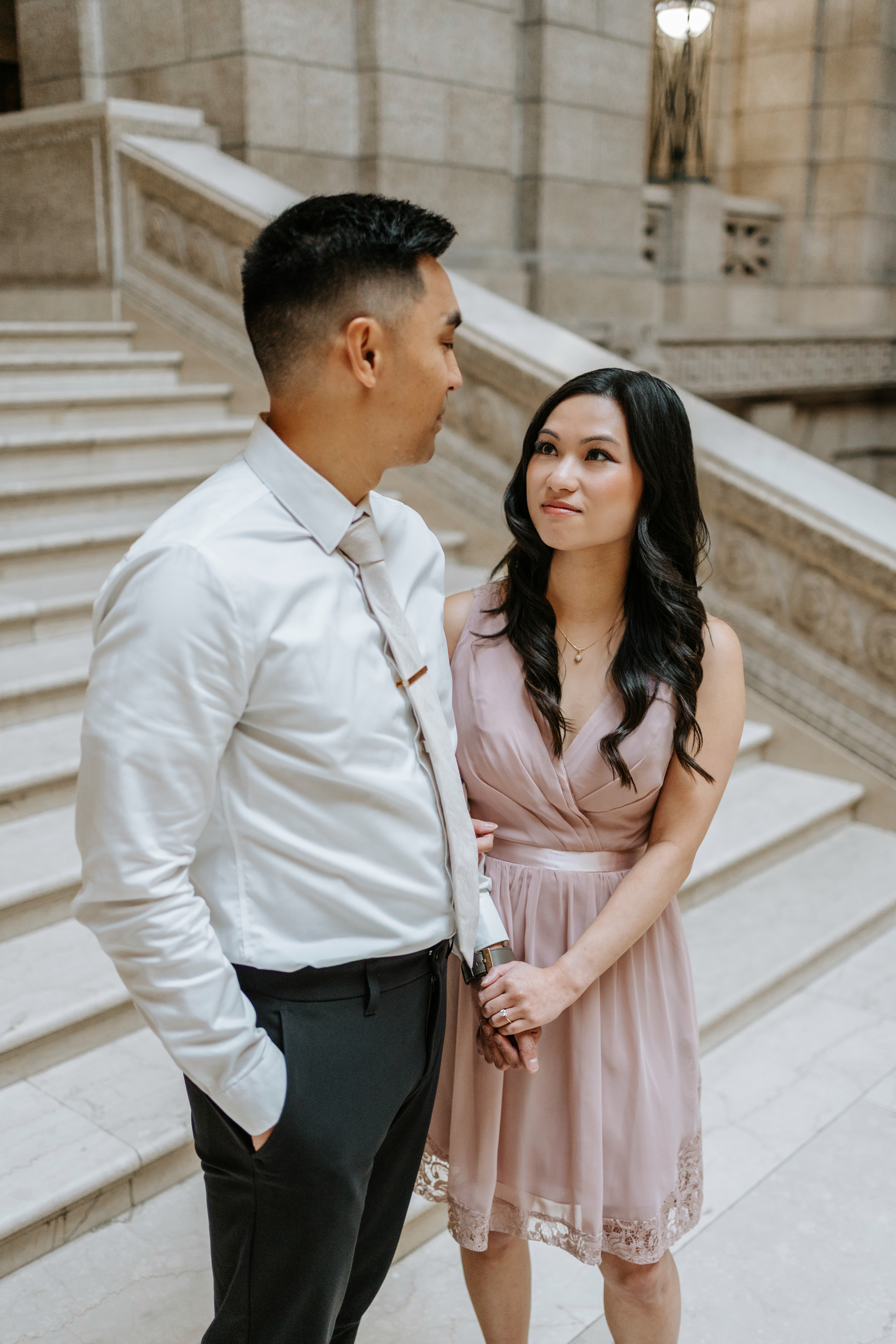 AJ and Julie close portrait on the grand staircase of the Manitoba Legislative Building — engagement session photography by Chris Ngo Winnipeg