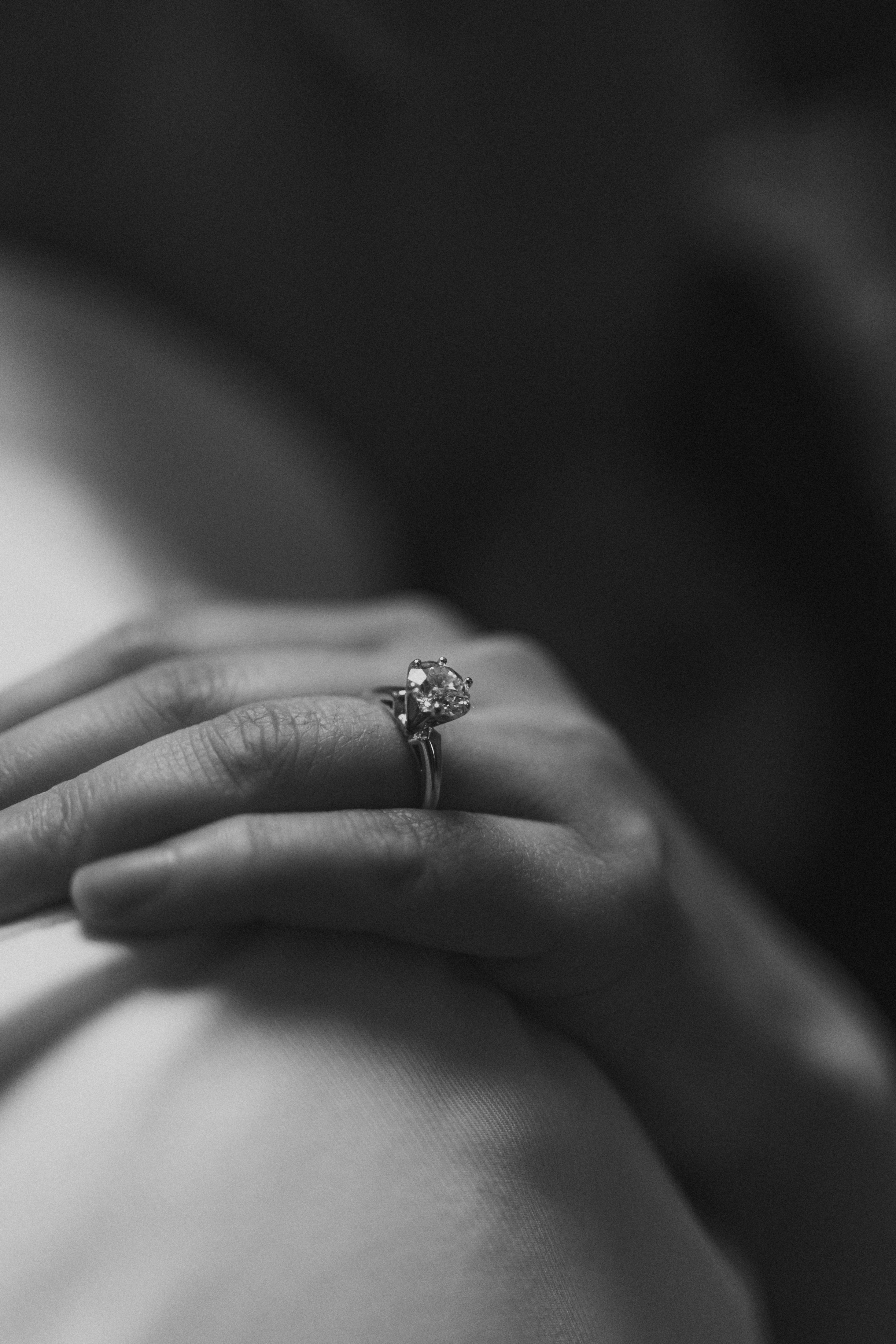 Black and white close-up of Julie's engagement ring solitaire — ring detail photography by Chris Ngo at Manitoba Legislative Building Winnipeg