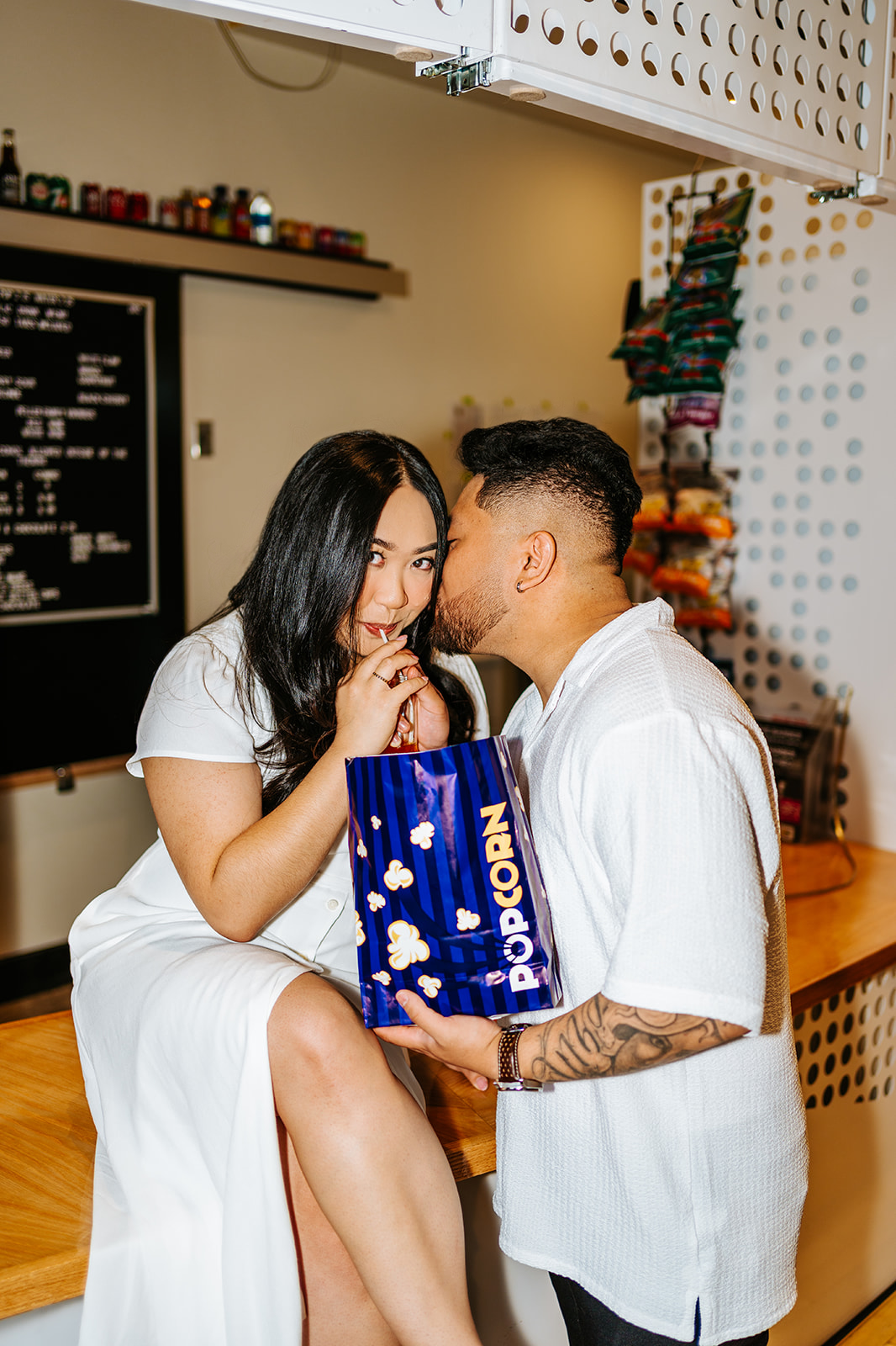 Ayanna and Paul engagement movie theatre popcorn Winnipeg — Ngo Photography