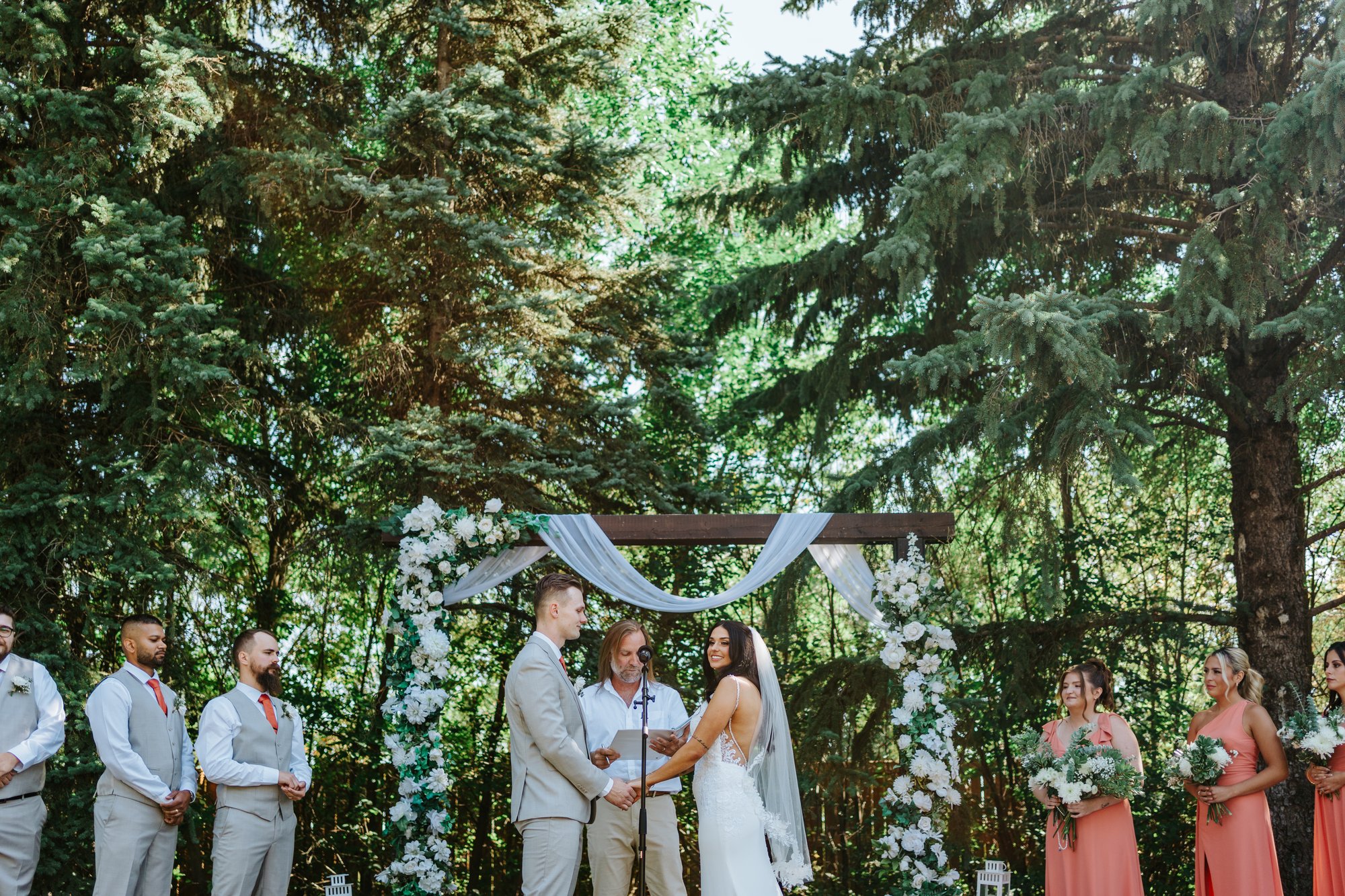Wedding ceremony altar and arch at Ashgrove Acres, full scene — documentary wedding photography by Chris Ngo, Ngo Photography Winnipeg