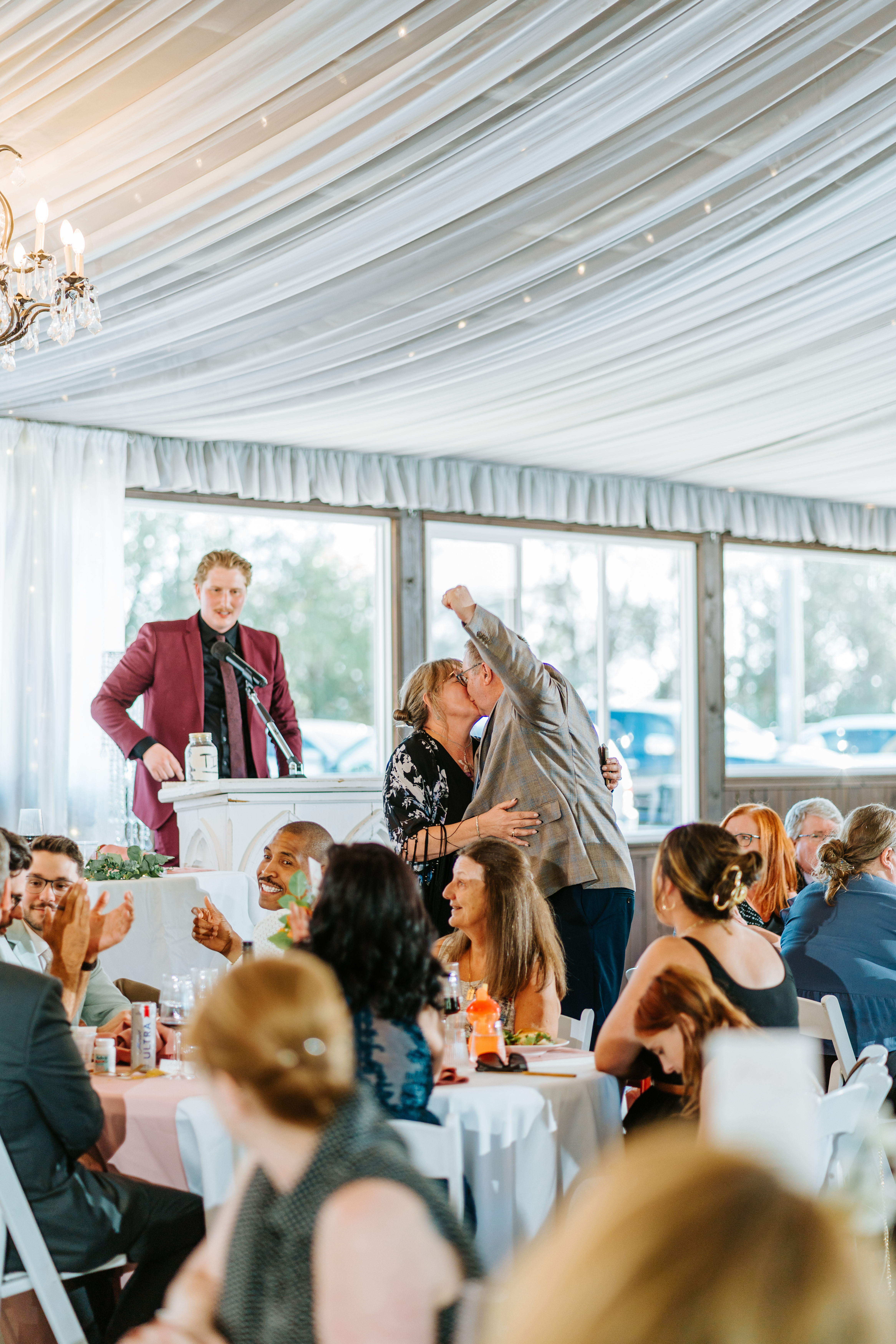 Candid moment during wedding toast at Brandon and Selena's Ashgrove Acres reception — documentary wedding photography by Chris Ngo Winnipeg