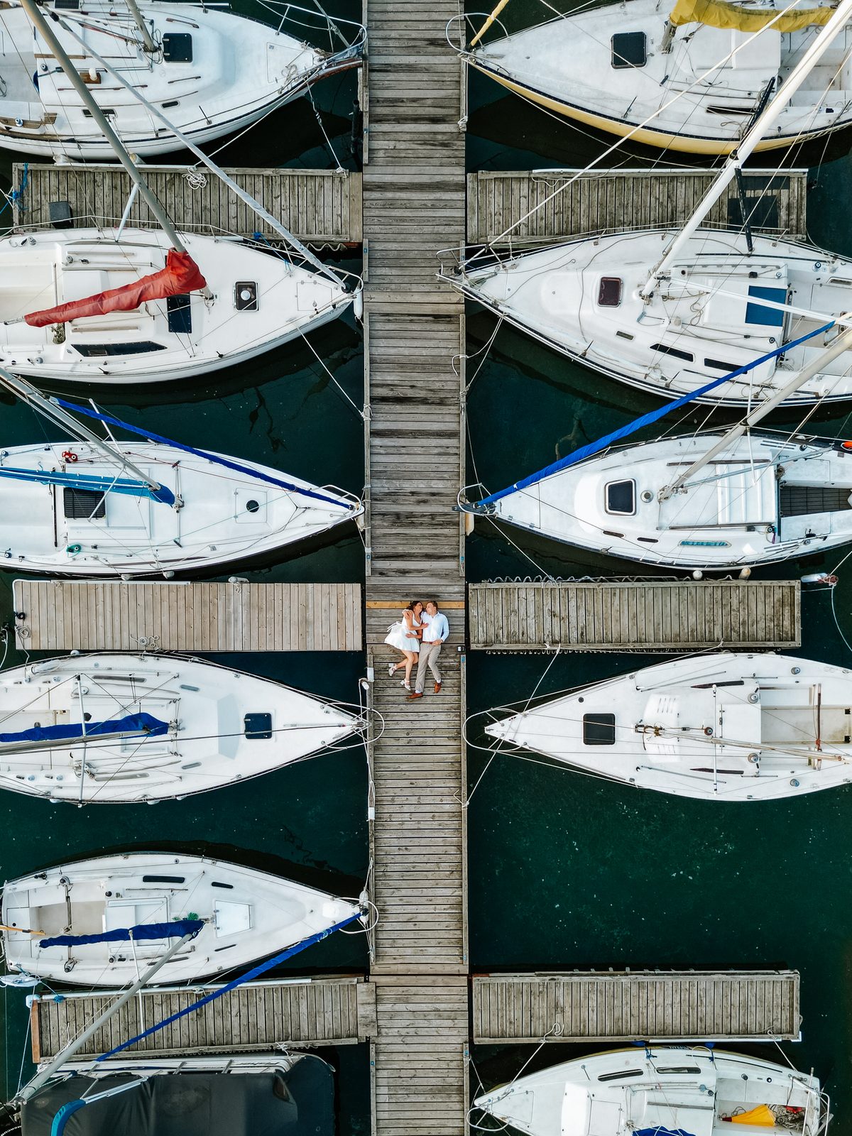 Aerial drone of Christina and Jack in the canoe approaching open Pelican Lake — golden hour, Ninette, Manitoba
