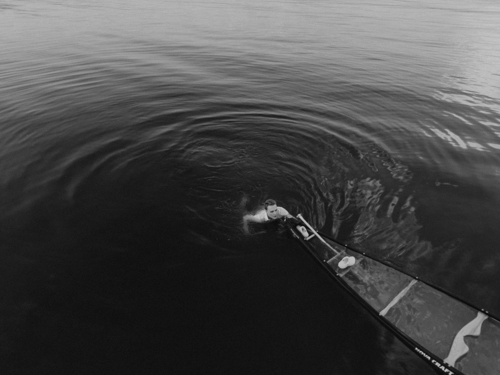 Aerial drone of Christina and Jack swimming together in Pelican Lake — Ninette, Manitoba