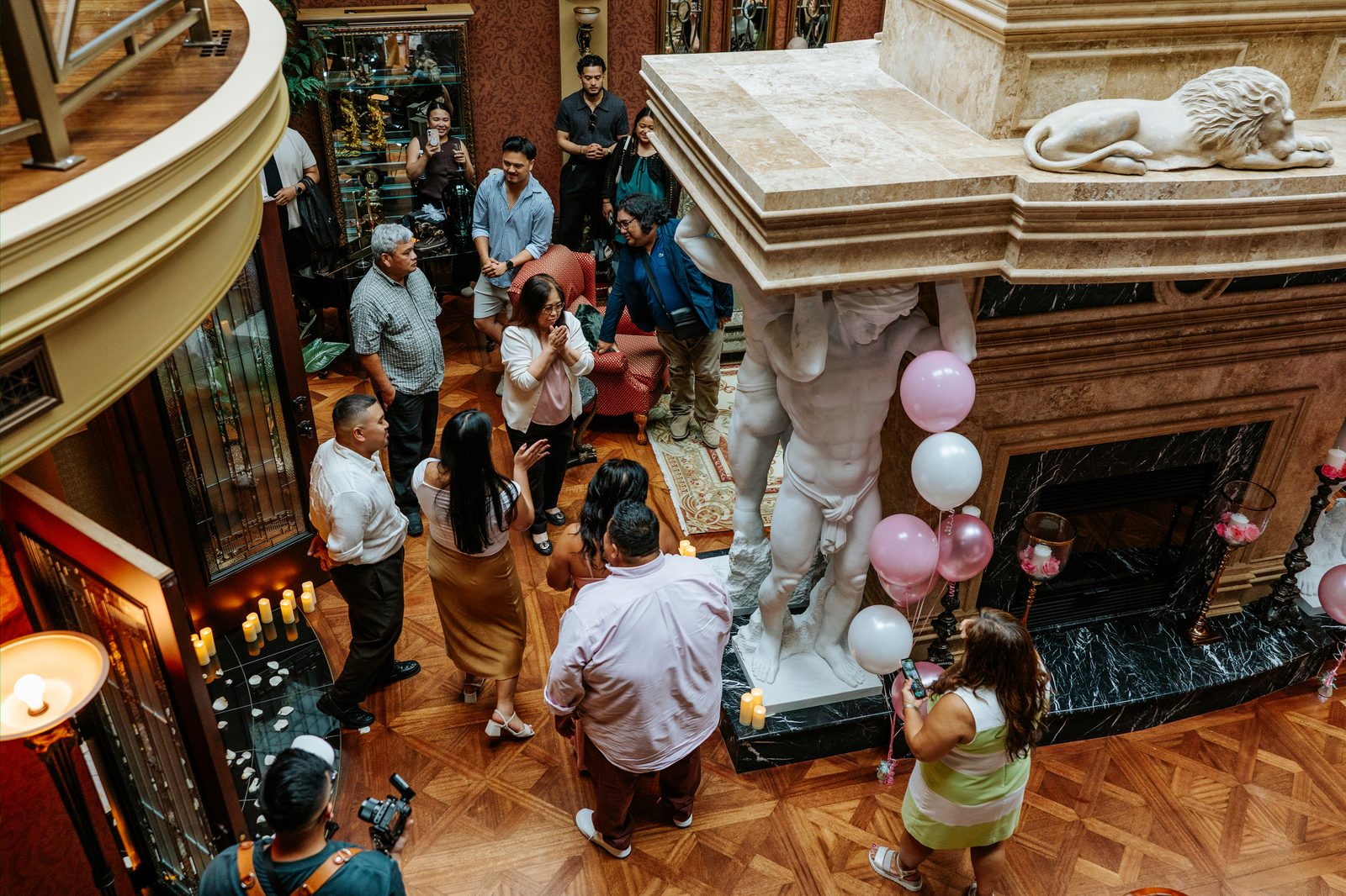 Deril and family celebrating after the proposal in downtown Winnipeg — surprise proposal photographer Chris Ngo