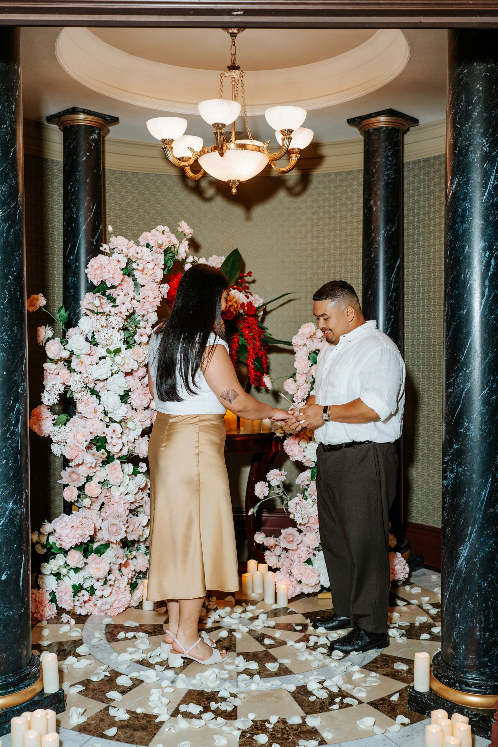 Annie's reaction as Deril proposes — surprise proposal photographer downtown Winnipeg — Ngo Photography