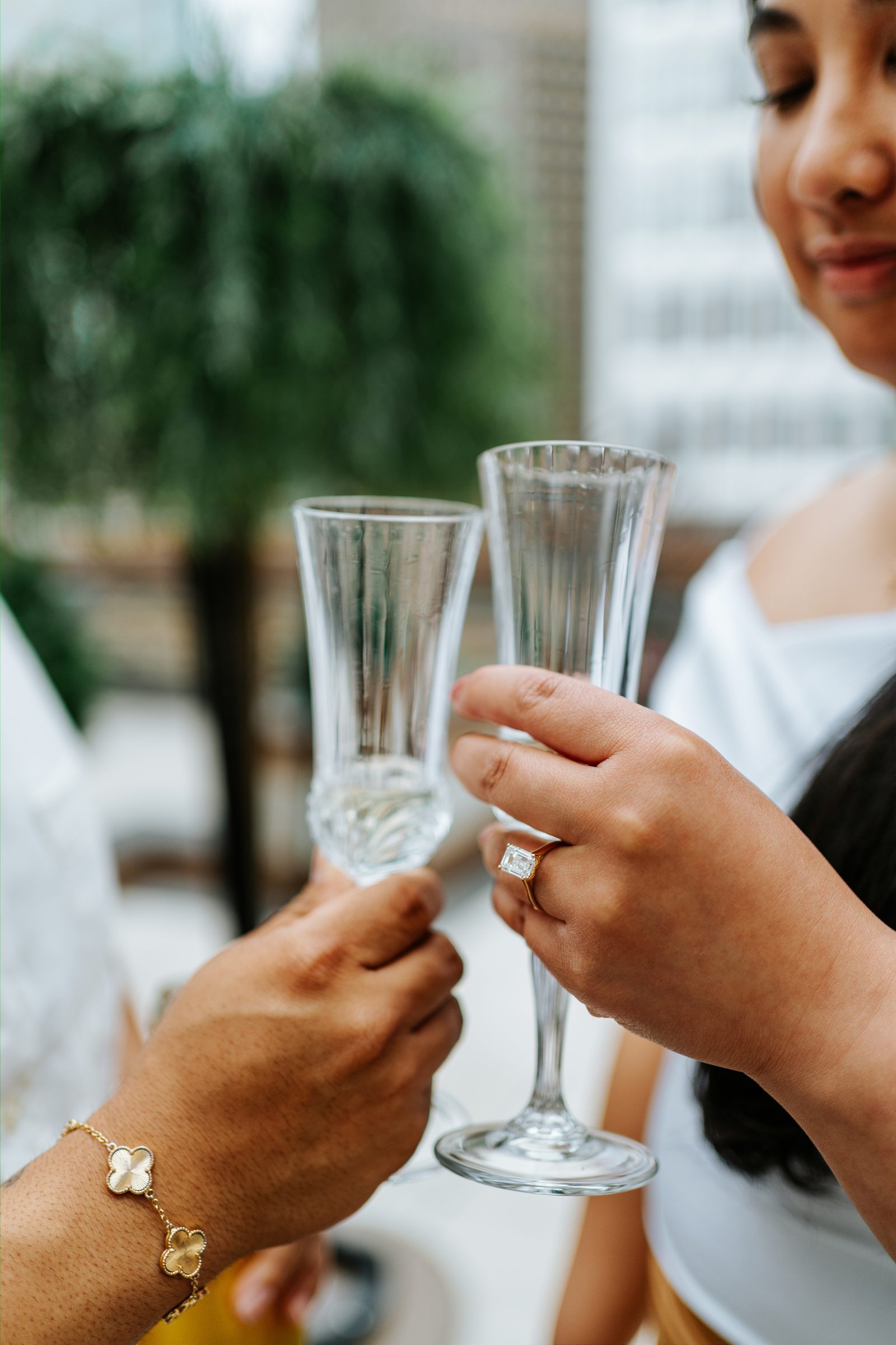 Wide portrait of Annie and Deril on the rooftop terrace with the downtown Winnipeg skyline — proposal photography by Chris Ngo Ngo Photography