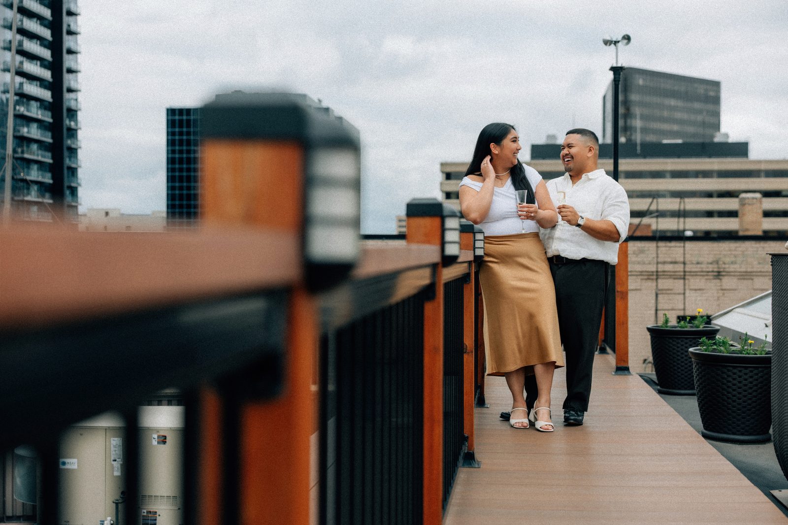 Annie and Deril on the historic staircase with candles on each step — intimate portrait photography after the surprise proposal in downtown Winnipeg — Chris Ngo