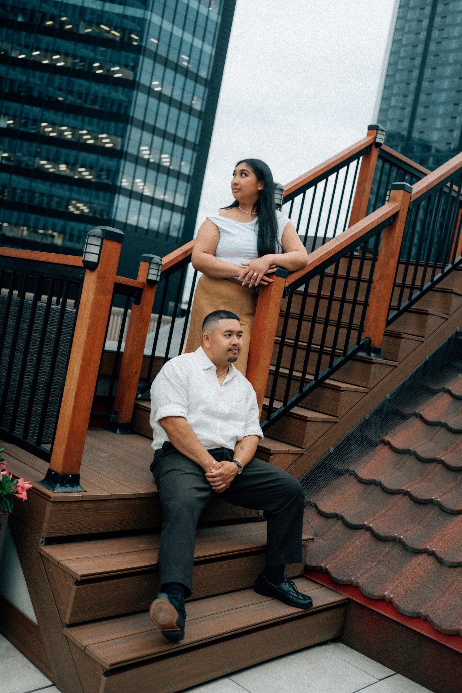 Final portrait of Annie and Deril on the historic staircase after the surprise proposal — downtown Winnipeg — proposal photographer Chris Ngo Ngo Photography
