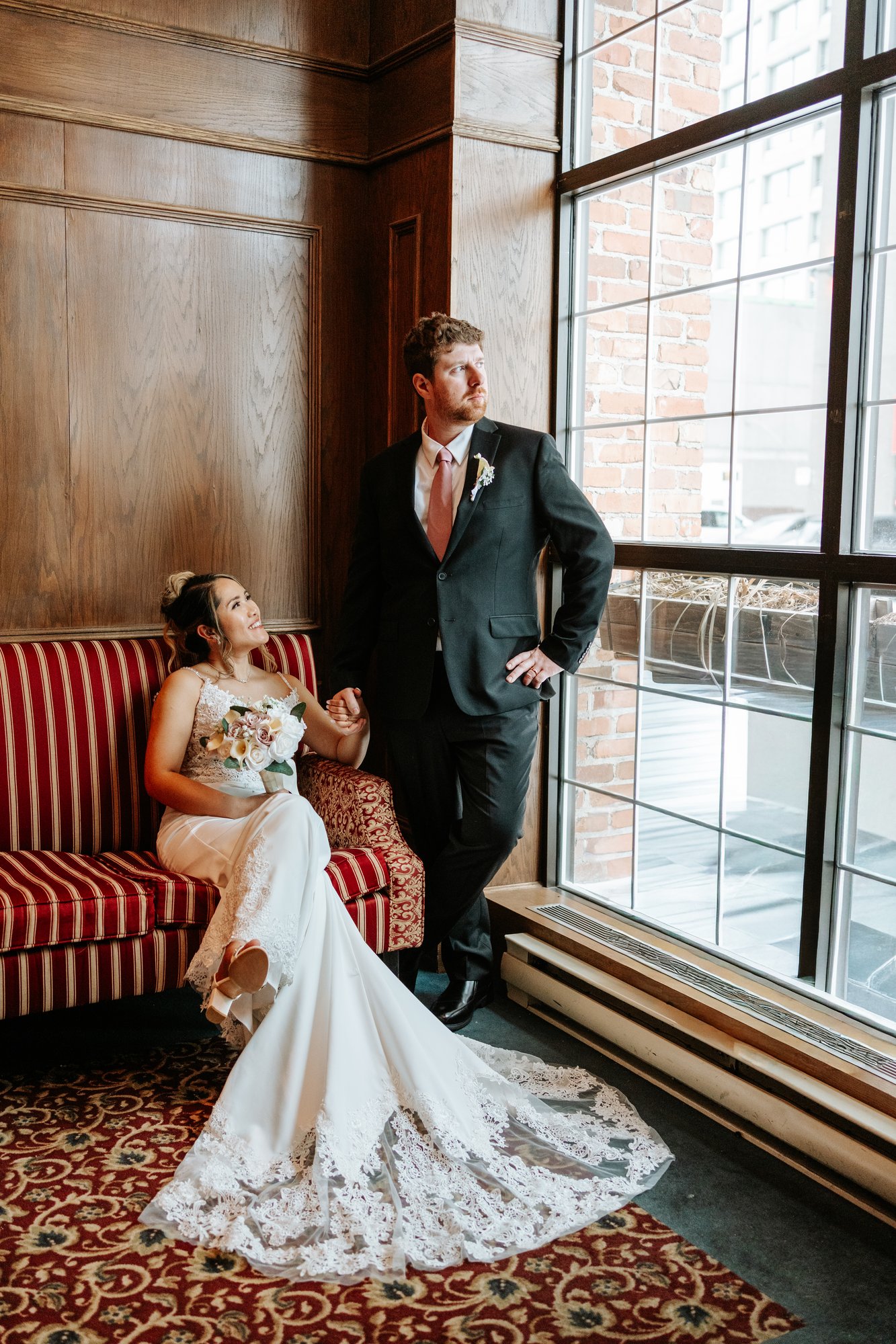 Eden and Justin standing portrait at Bailey's Restaurant Winnipeg winter wedding — Ngo Photography