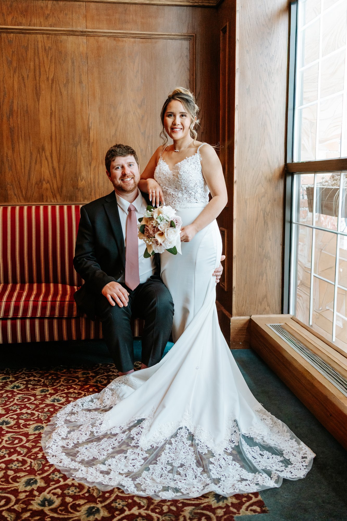 Closeup of Eden and Justin at the window at Bailey's Restaurant Winnipeg wedding — Ngo Photography