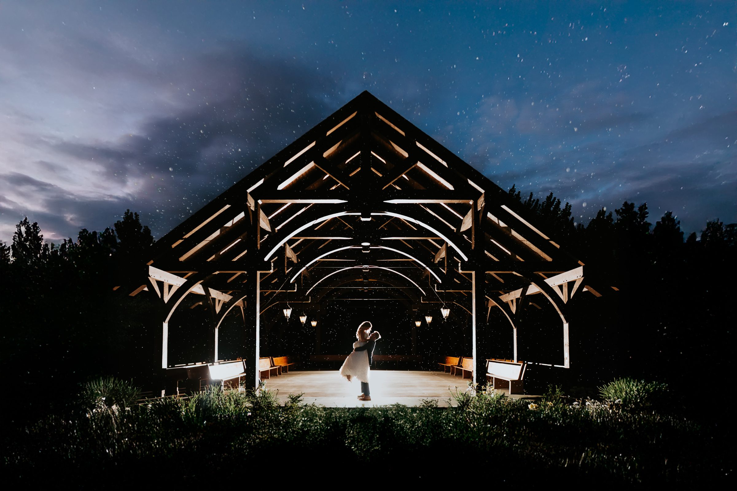Erin and Jayden dancing under the stars in the timber pavilion at Buttercup Café, Manitoba — photographed by Chris Ngo, Ngo Photography