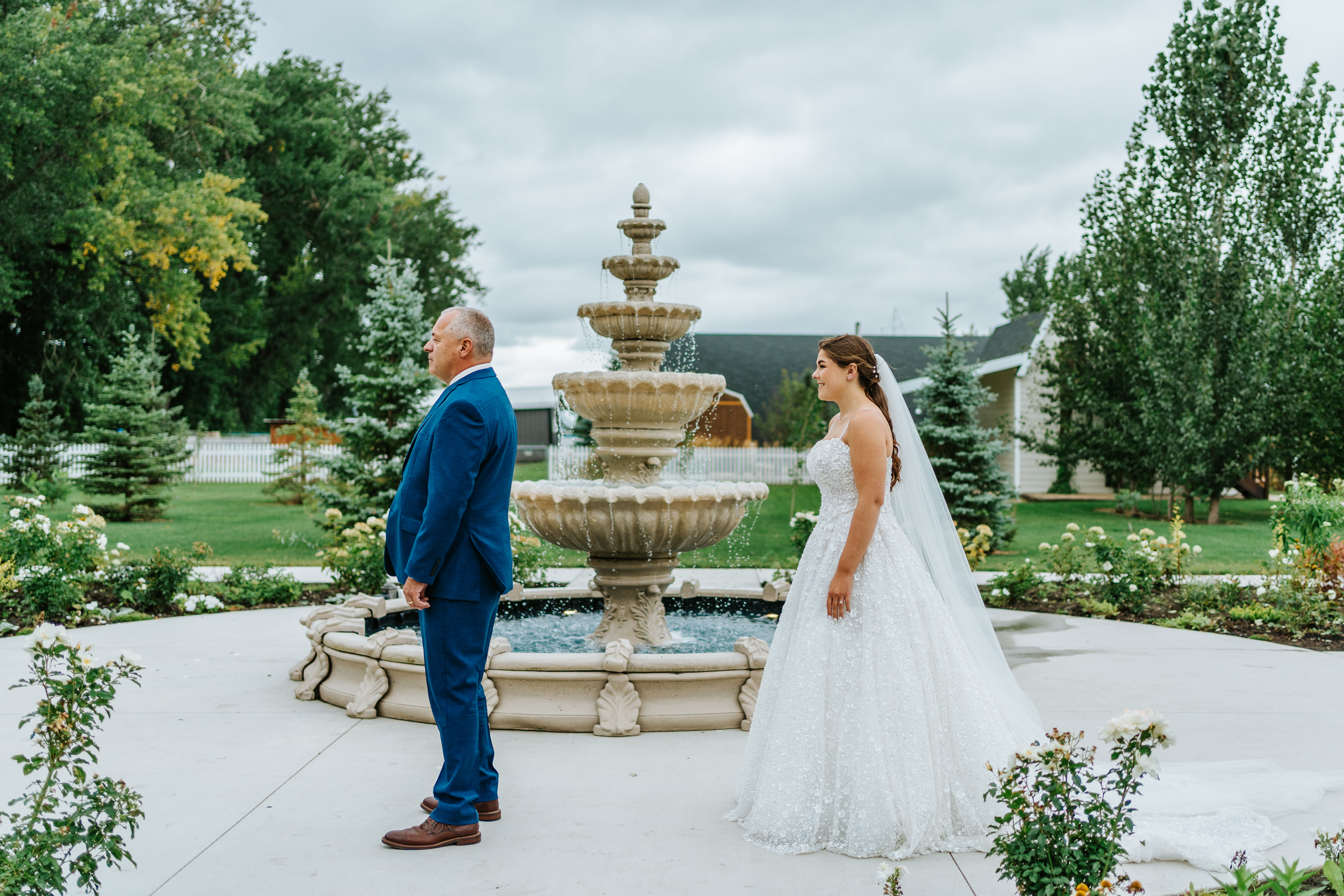 Erin's father turning around to see her for the first time at Buttercup Café fountain — father daughter first look wedding photography by Chris Ngo Winnipeg