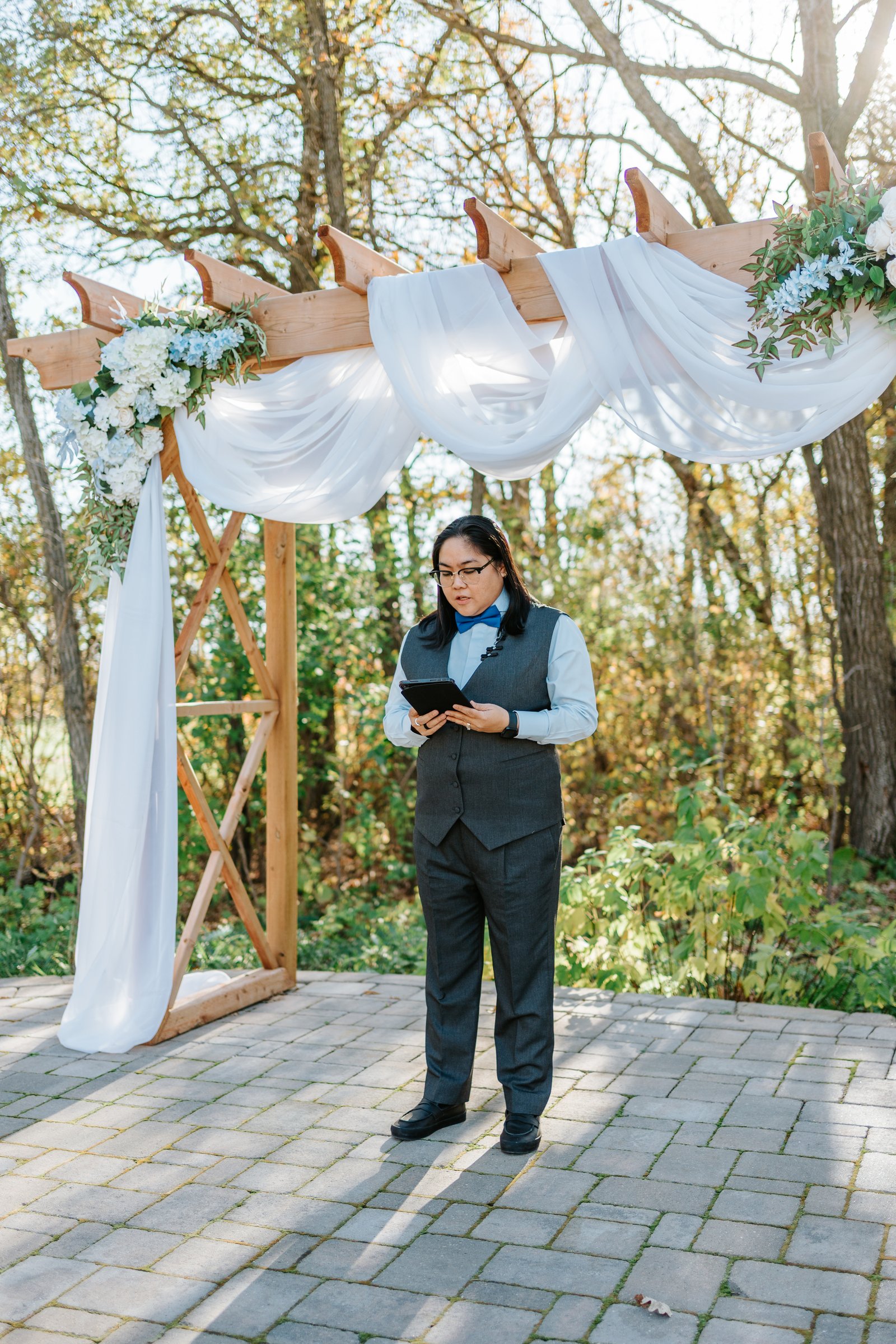 Gin watching Marieanne walk down the aisle at Bel Acres outdoor ceremony — wedding photography by Ngo Photography Winnipeg
