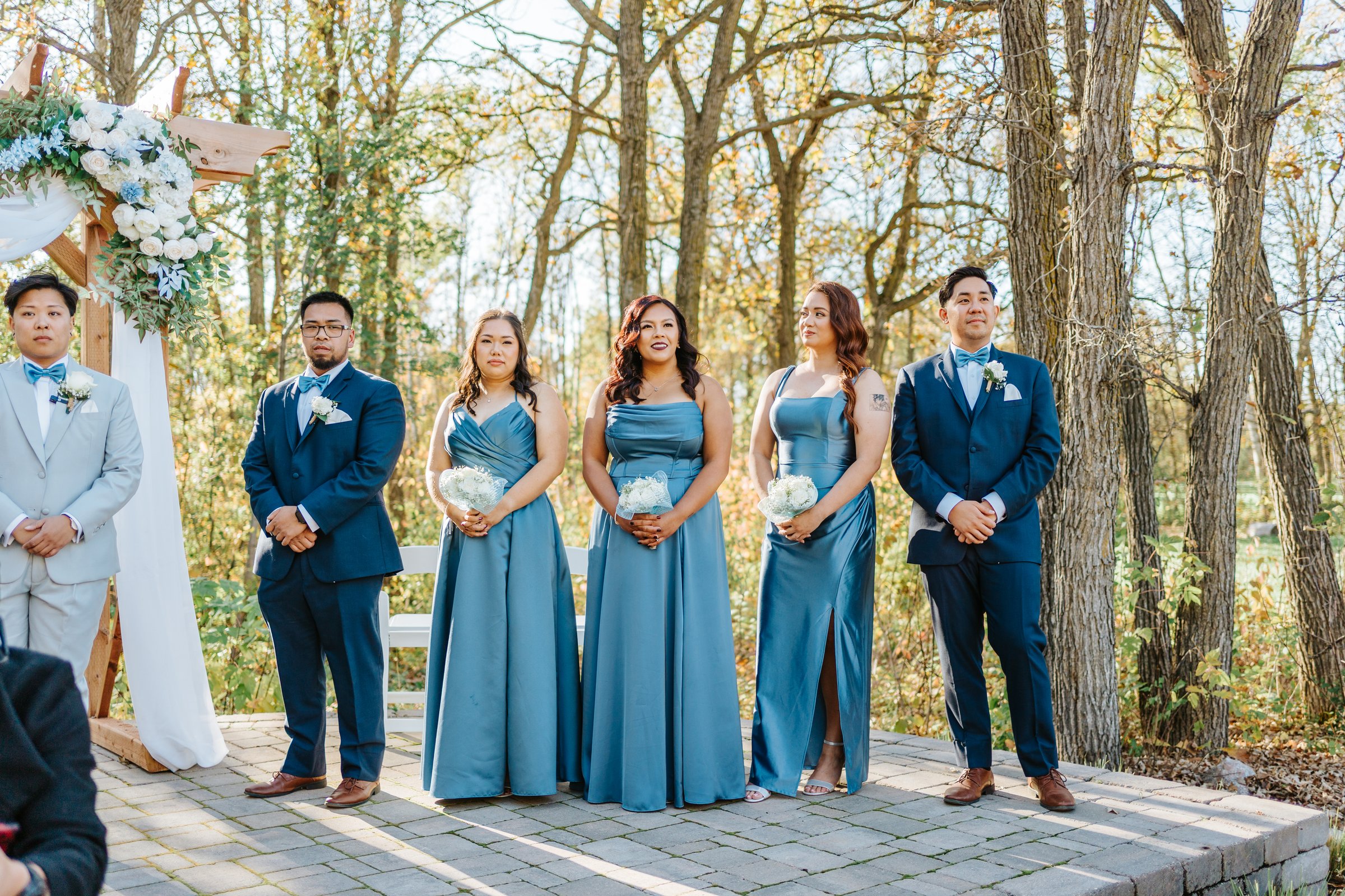 Ring exchange at Bel Acres outdoor ceremony site — Gin and Marieanne wedding photography by Chris Ngo, Ngo Photography Winnipeg