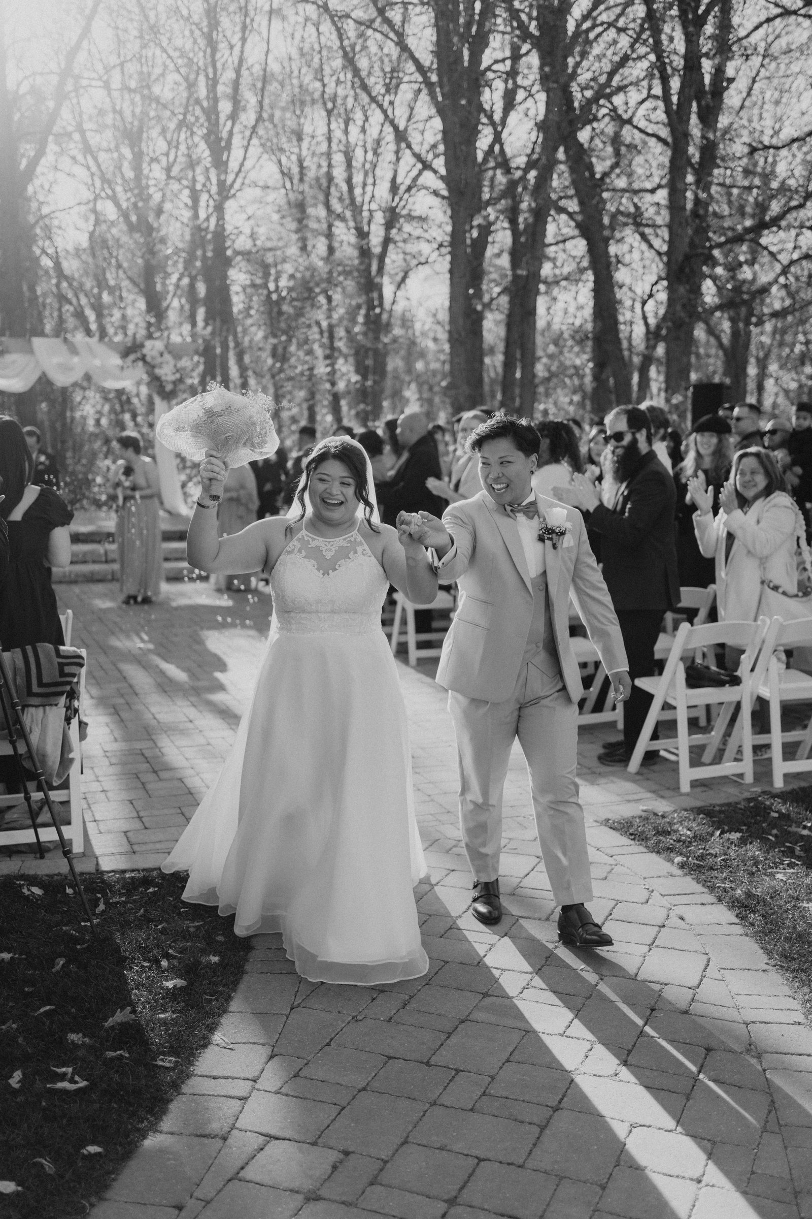 Guests celebrating during cocktail hour at Bel Acres — fall wedding photography by Ngo Photography Winnipeg