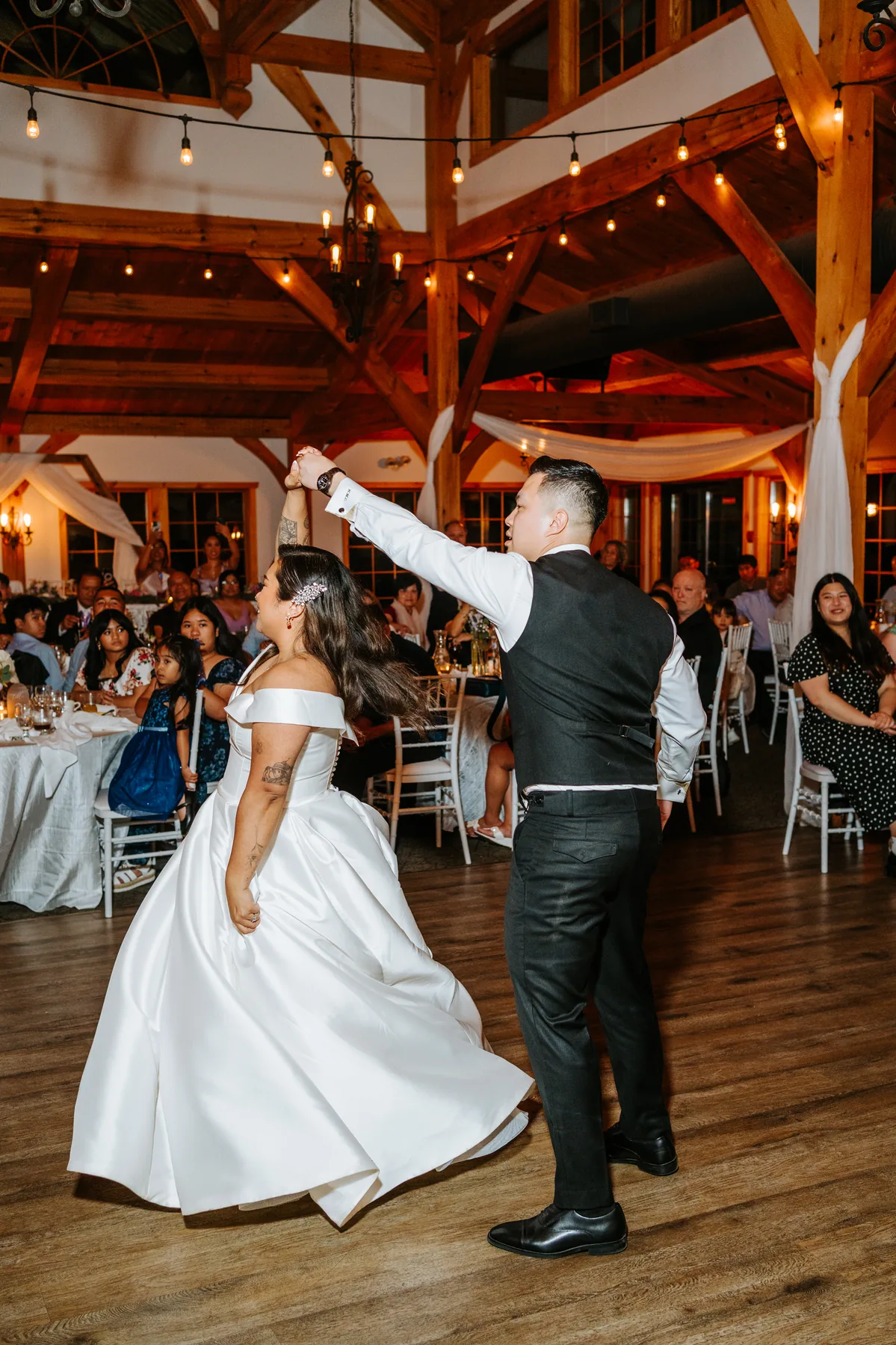 Filipino money dance — guests pinning dollar bills to couple at Bridges Golf Course wedding, Winnipeg