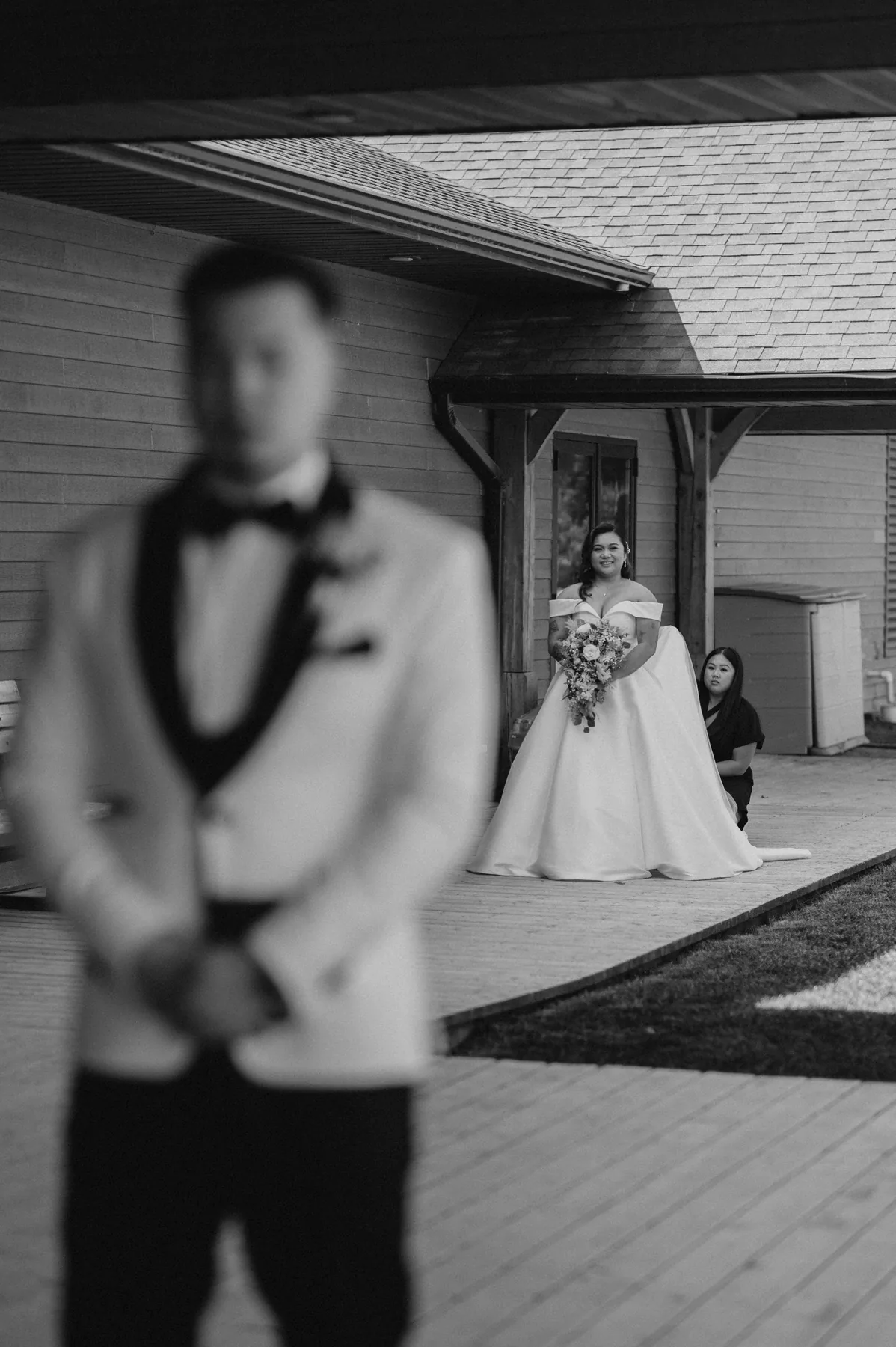 Ring exchange during outdoor ceremony at Bridges Golf Course, black and white — Winnipeg wedding