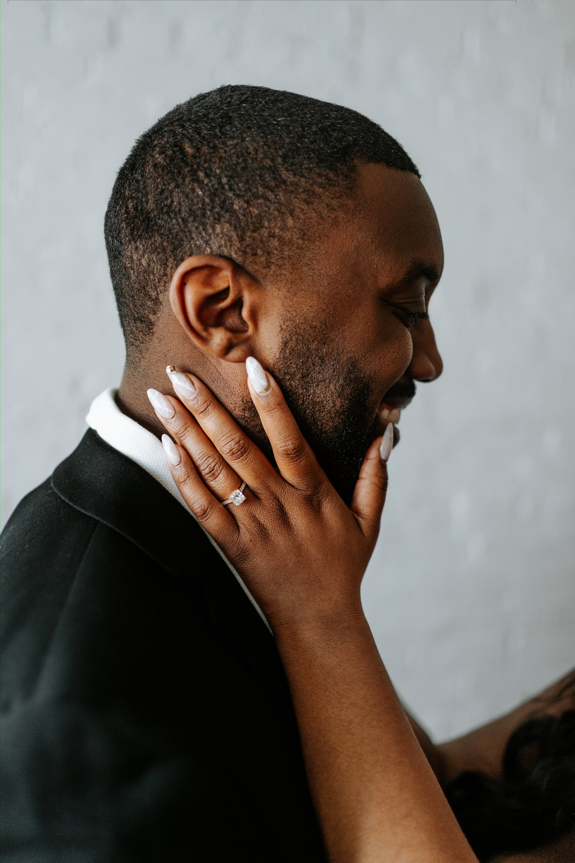 Jaida and Jordan walking through the downtown Winnipeg core — engagement photography by Chris Ngo