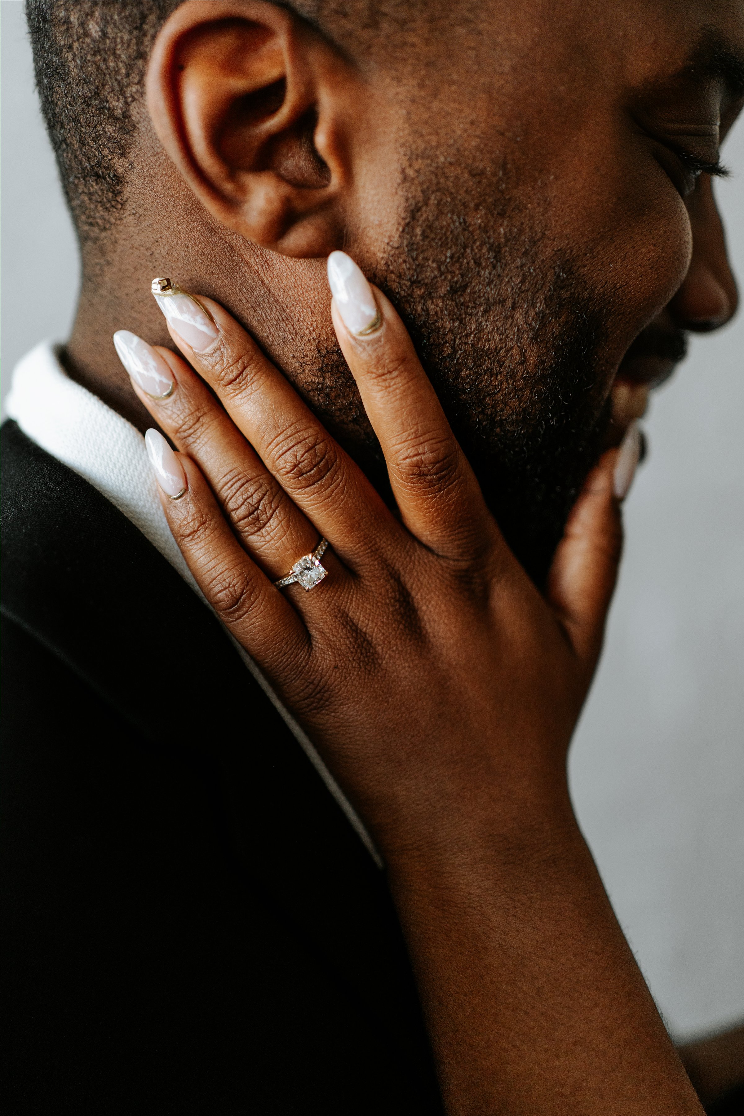 Jordan and Jaida portrait on a downtown Winnipeg street — engagement photography by Ngo Photography