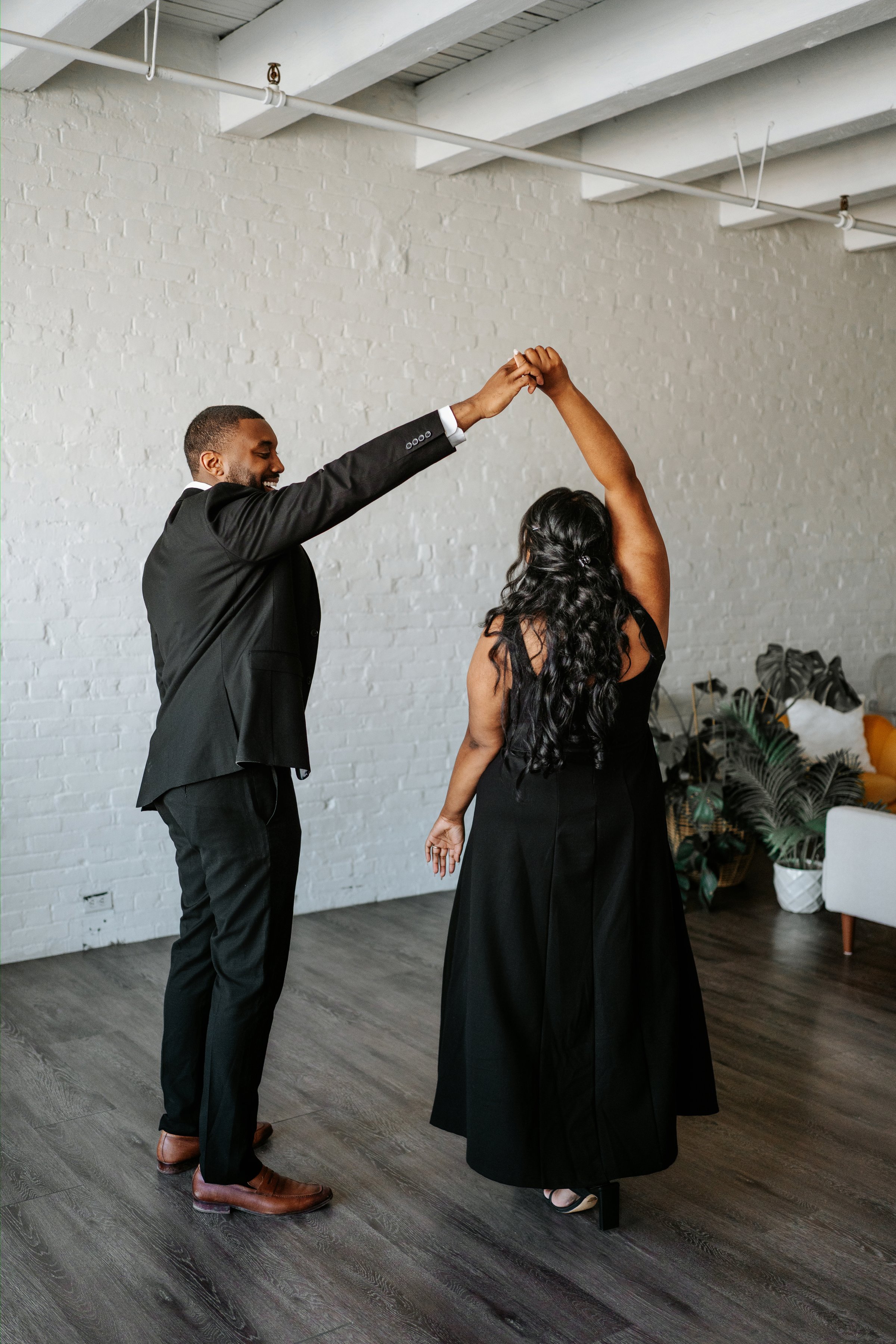 Jaida and Jordan portrait with soft downtown Winnipeg background — engagement photography by Ngo Photography