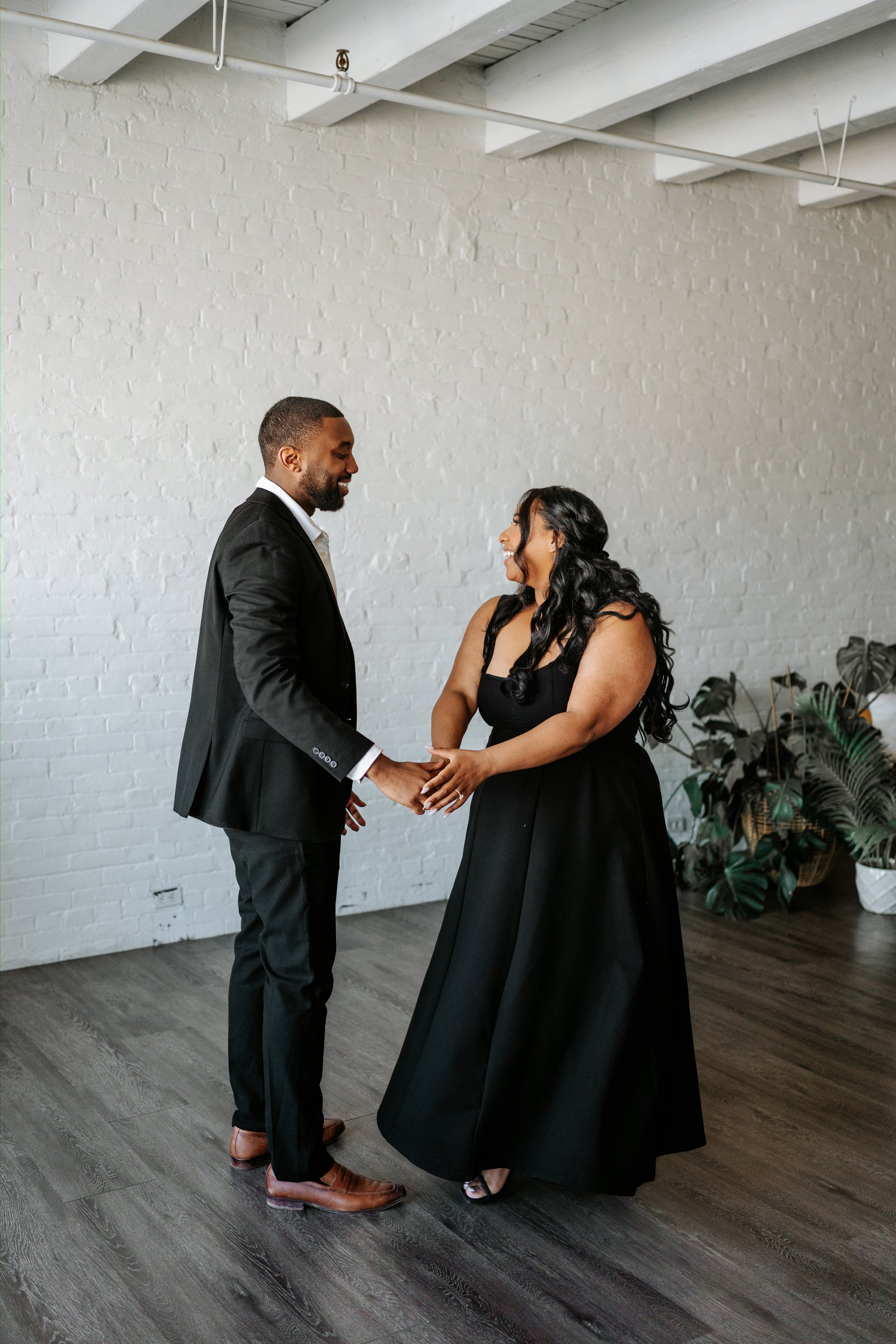 Close portrait of Jaida and Jordan in downtown Winnipeg — engagement photography by Chris Ngo
