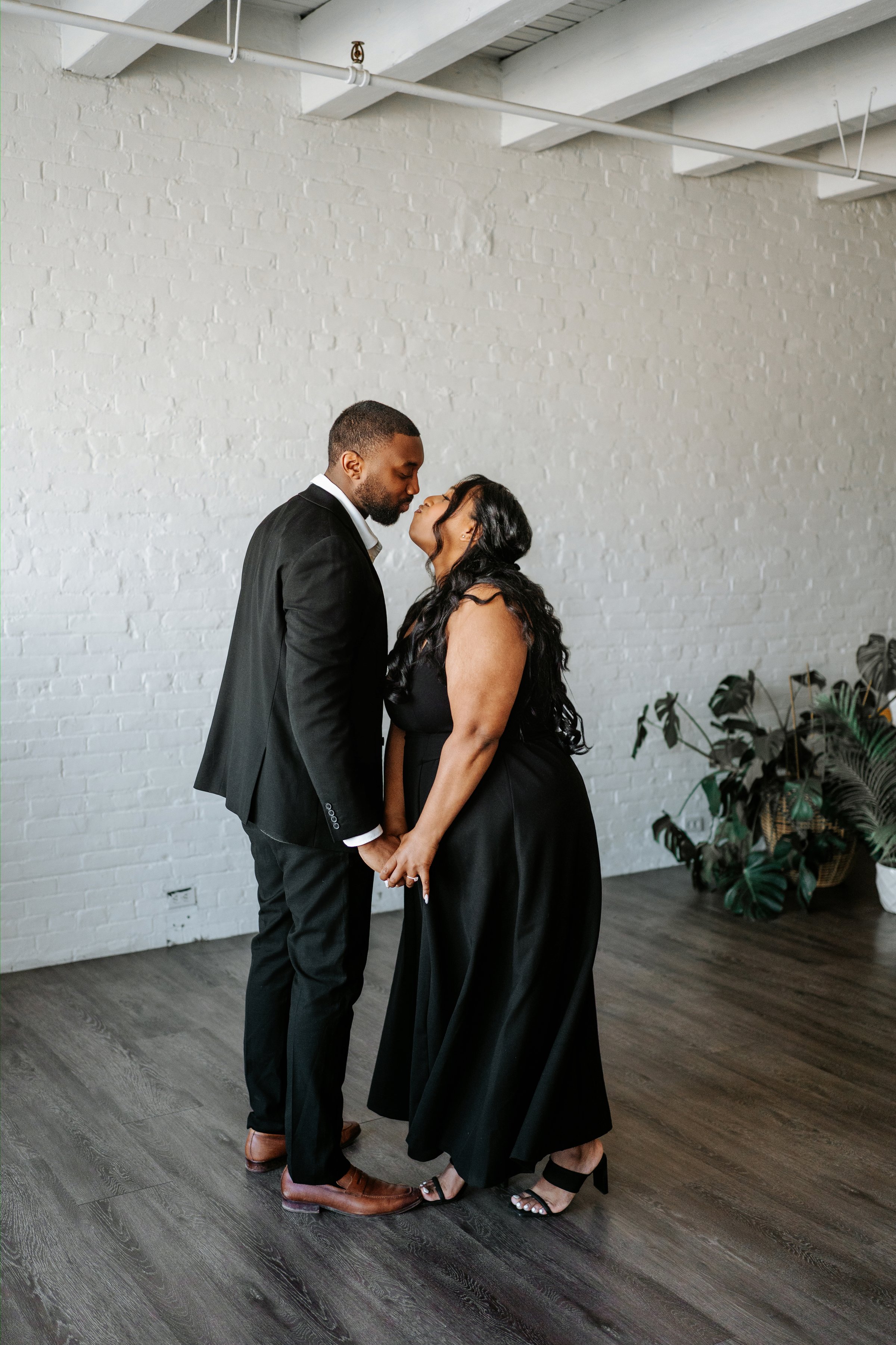 Jaida and Jordan portrait on a downtown Winnipeg street — engagement photography by Ngo Photography