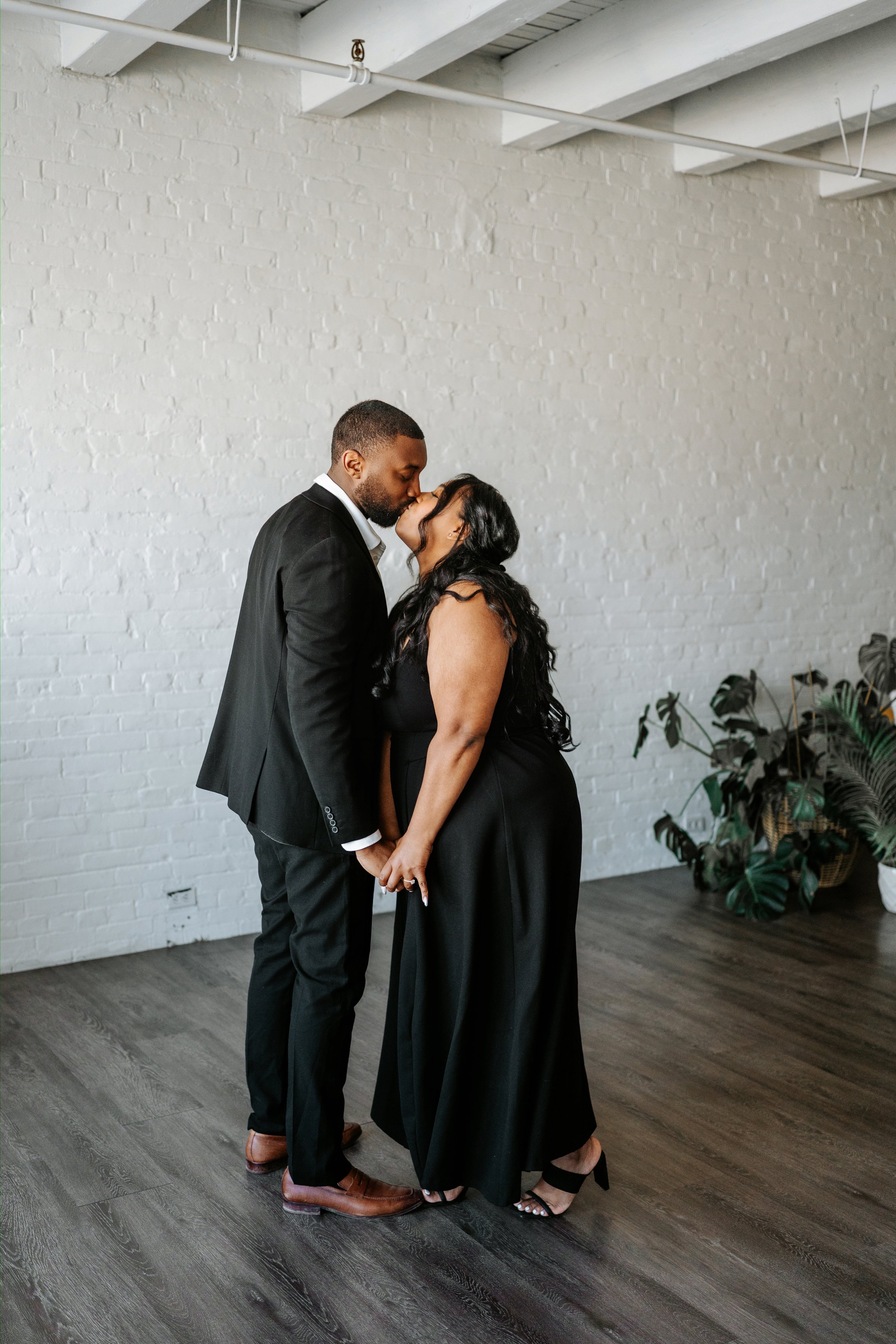 Jaida and Jordan candid portrait in the downtown Winnipeg core — engagement photography by Chris Ngo