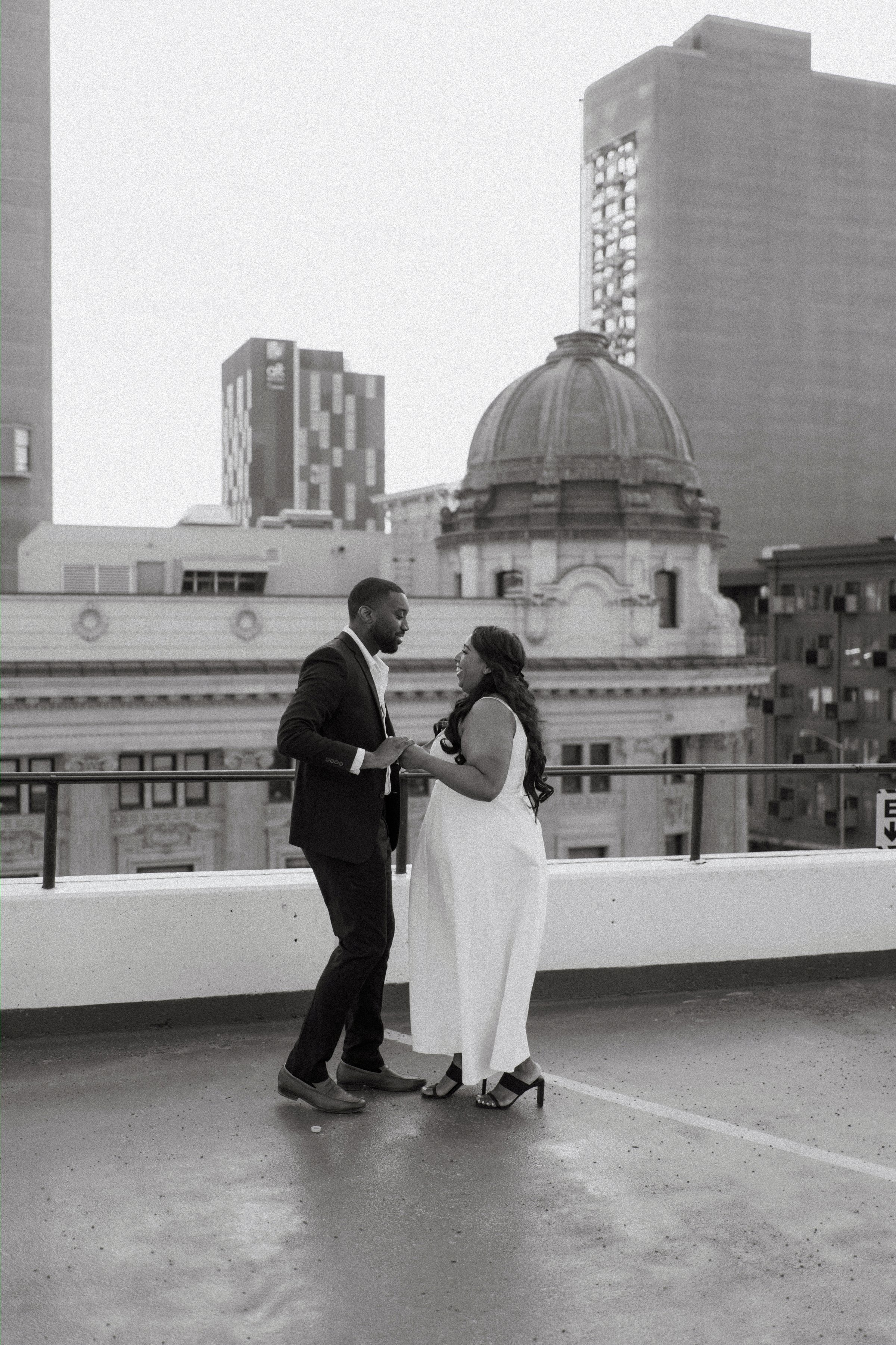 Jaida and Jordan close portrait at golden hour on a Winnipeg parkade — engagement photography by Ngo Photography