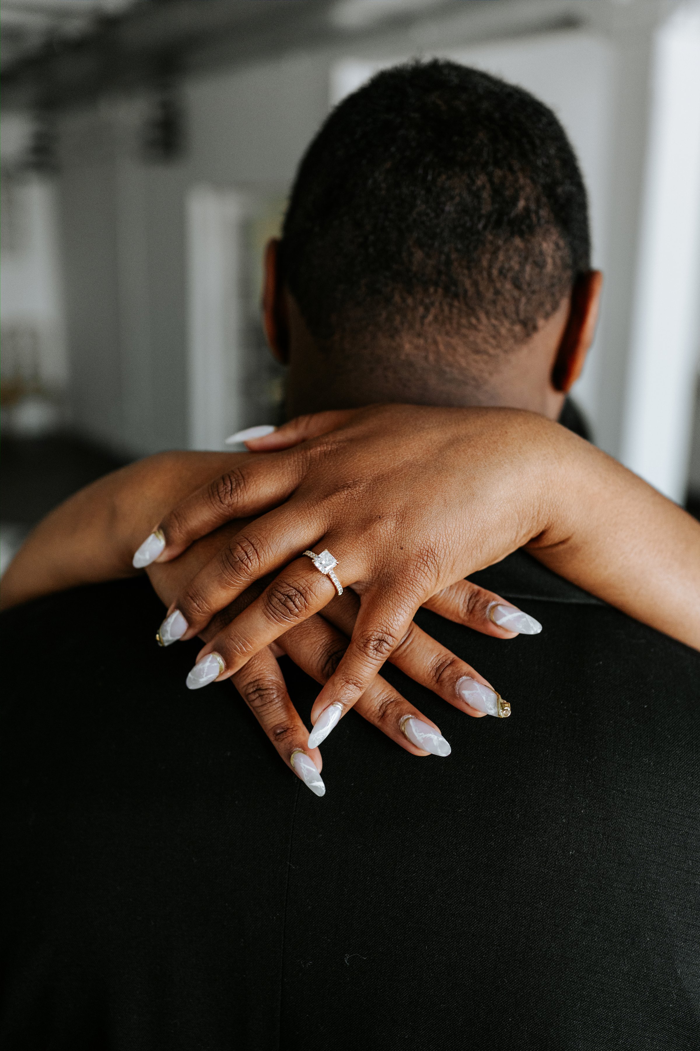 Jaida and Jordan walking through the Exchange District in Winnipeg during their engagement session — photography by Chris Ngo Ngo Photography