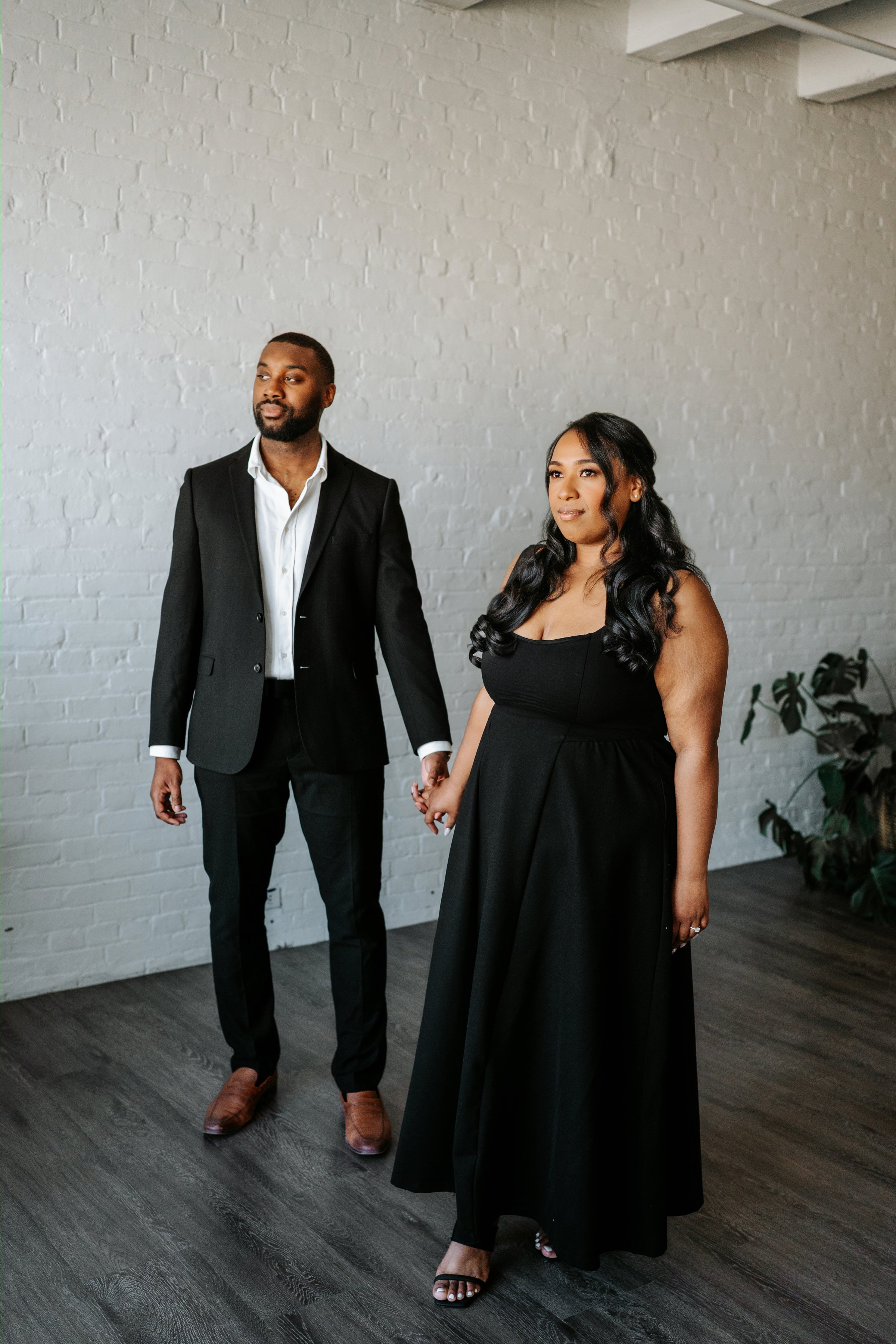 Jordan and Jaida candid moment on the streets of the Exchange District Winnipeg — engagement session by Ngo Photography