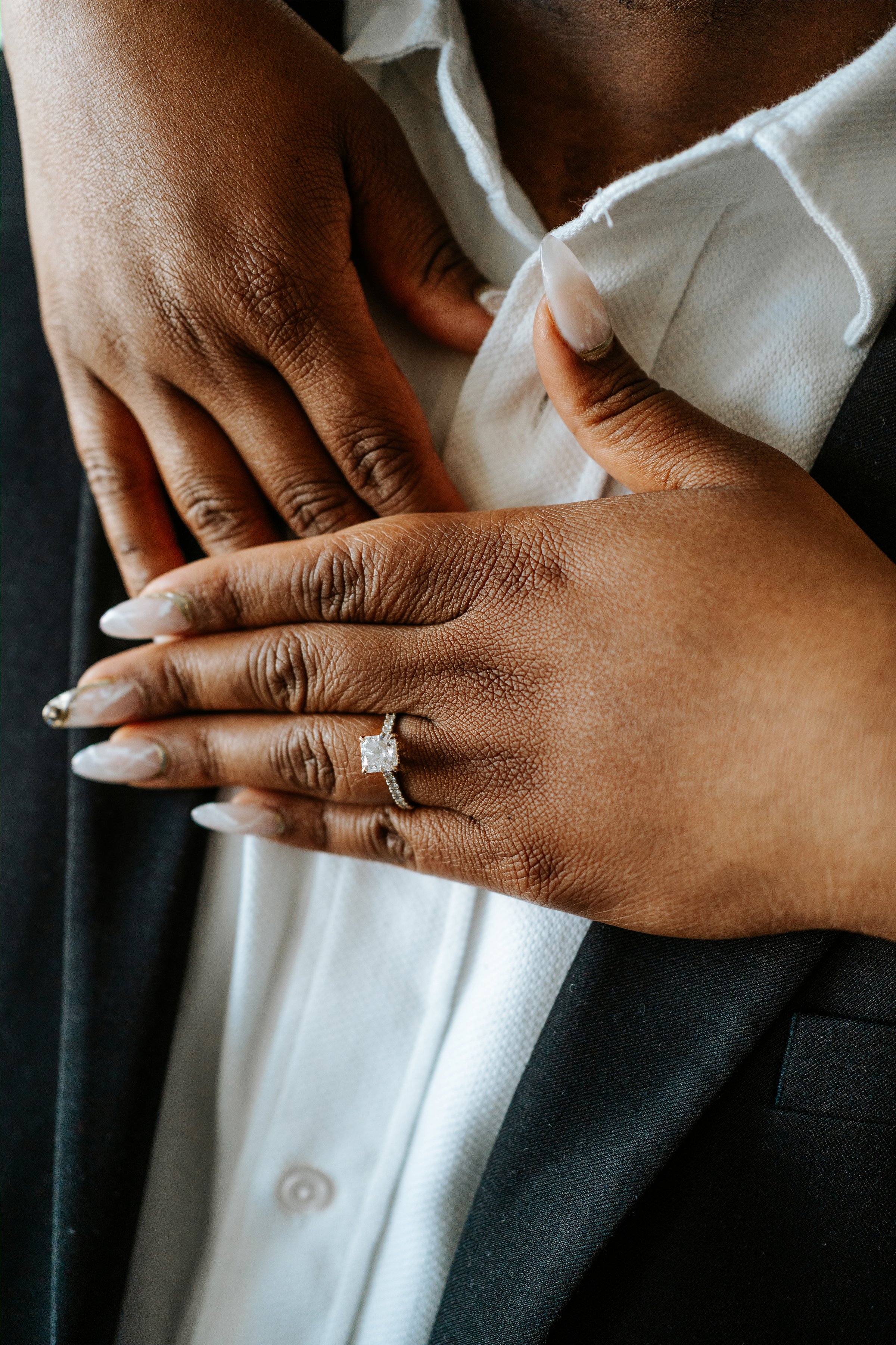 Jaida laughing with Jordan in the photography studio — engagement session by Chris Ngo Ngo Photography Winnipeg