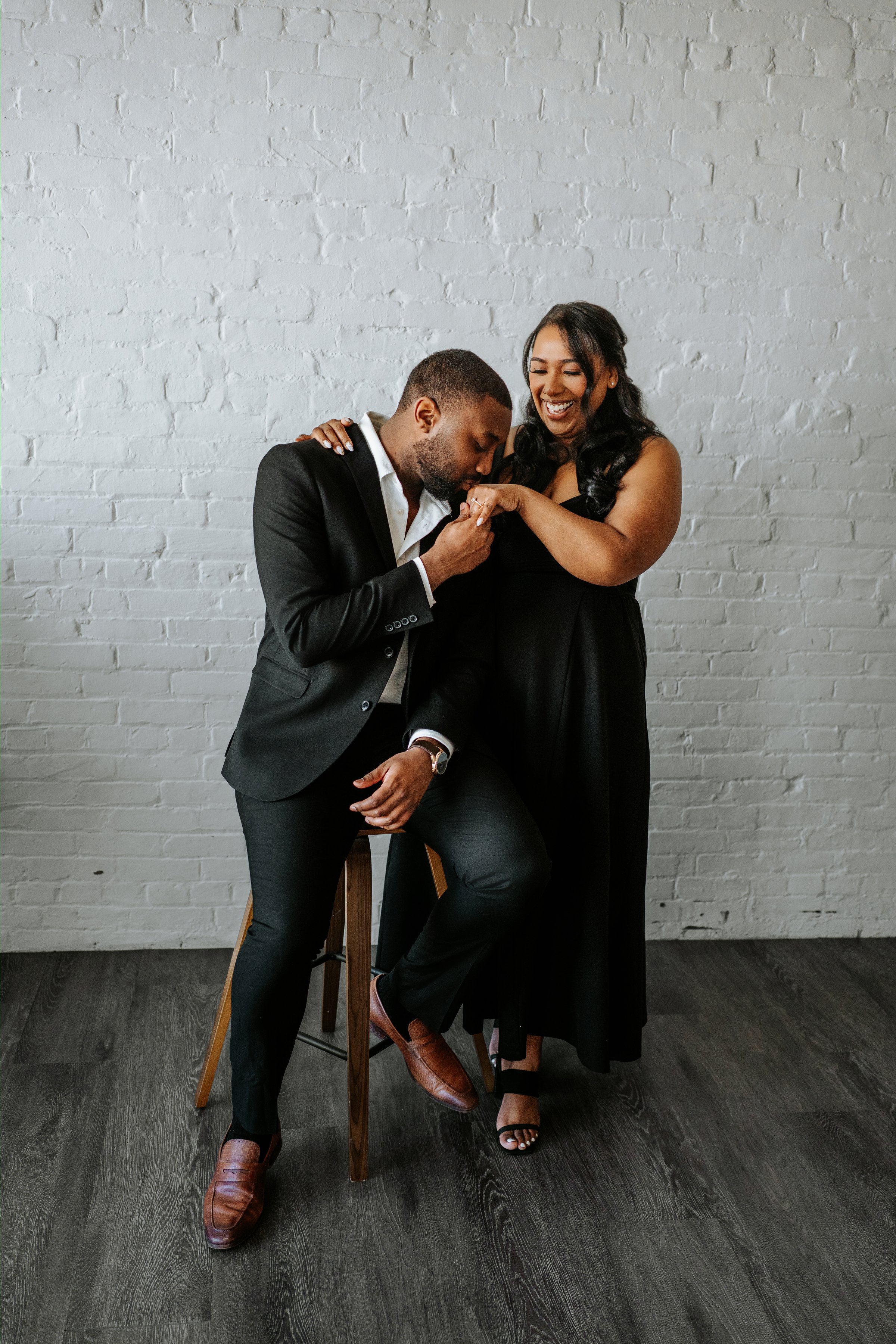 Jaida and Jordan intimate portrait in studio with soft window light — downtown Winnipeg engagement photography by Ngo Photography