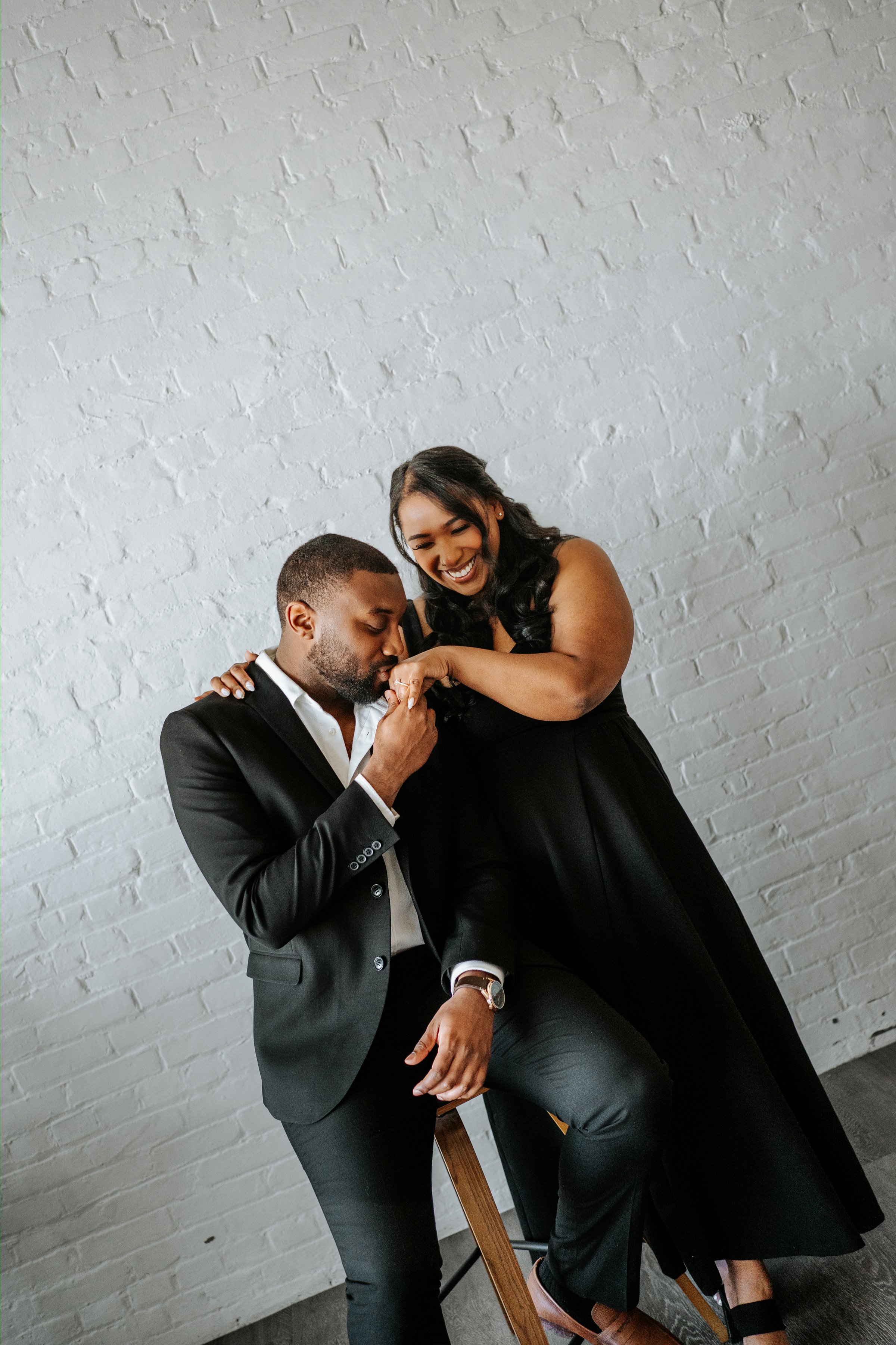 Close portrait of Jaida and Jordan embracing in the studio — downtown Winnipeg engagement photography by Ngo Photography