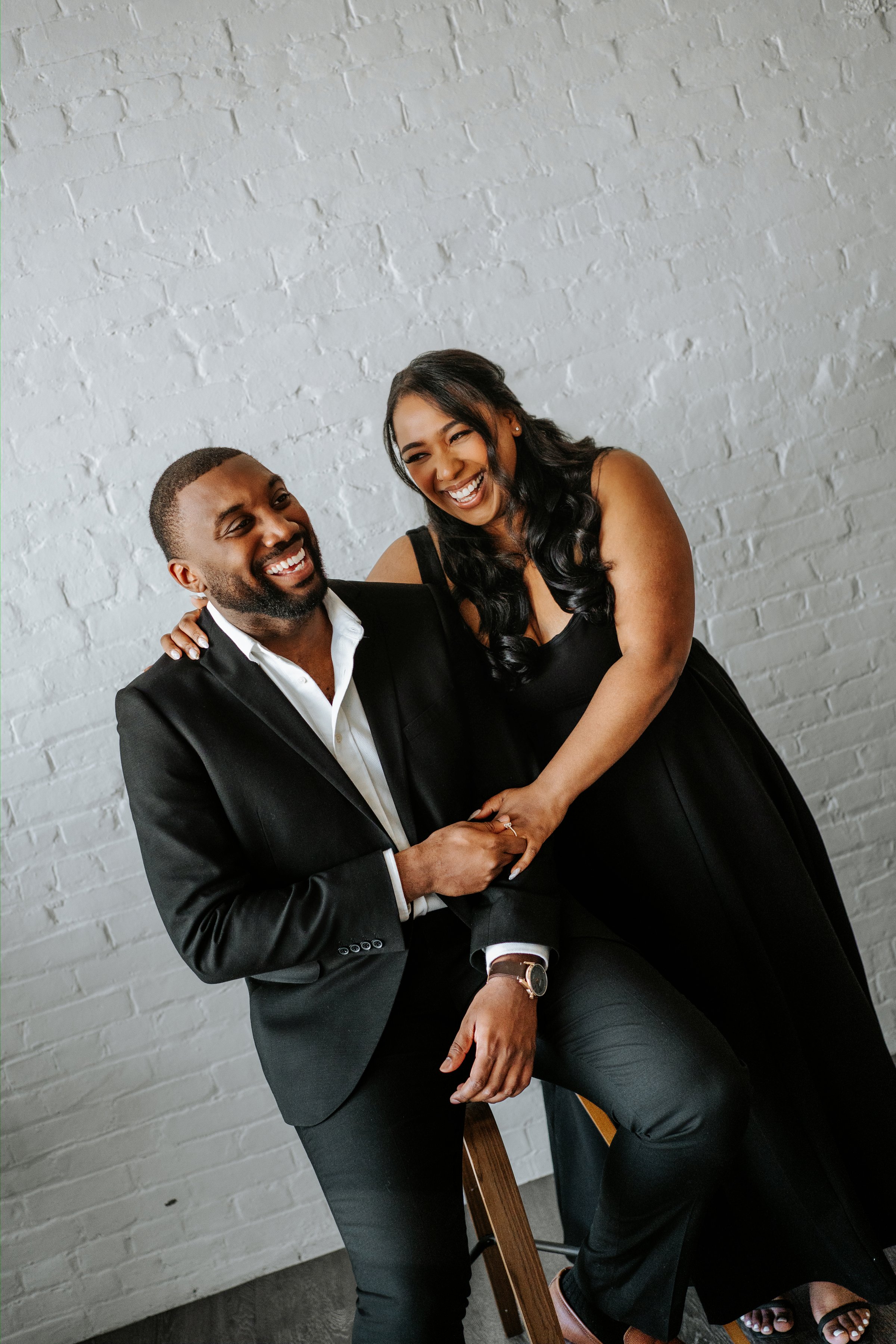 Jaida and Jordan candid moment in the downtown Winnipeg photography studio — engagement photography by Chris Ngo