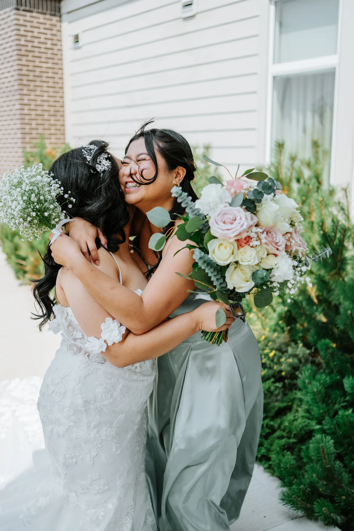 Jay hugging her bridesmaid before the ceremony — Hawthorne Estates wedding, Manitoba