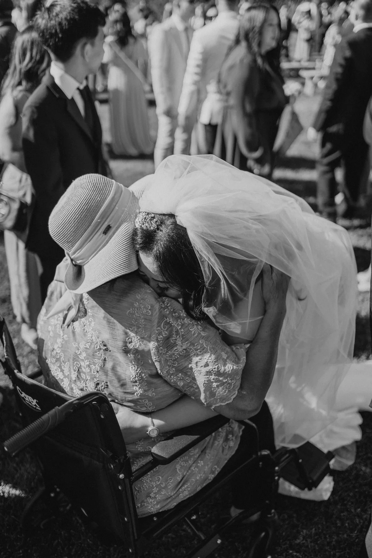 Jay sharing an emotional embrace after the ceremony at Hawthorne Estates — black and white, Manitoba