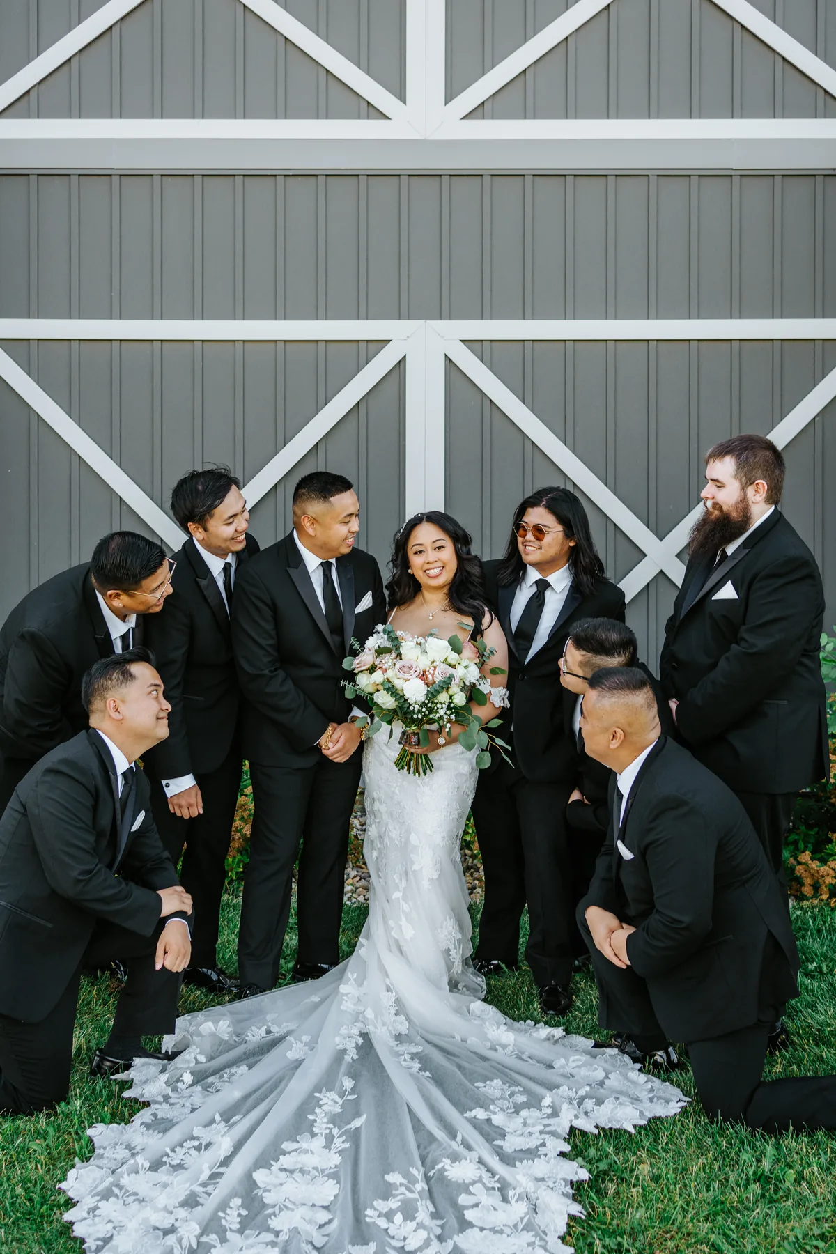 Jay with the groomsmen in front of the barn doors at Hawthorne Estates, Manitoba