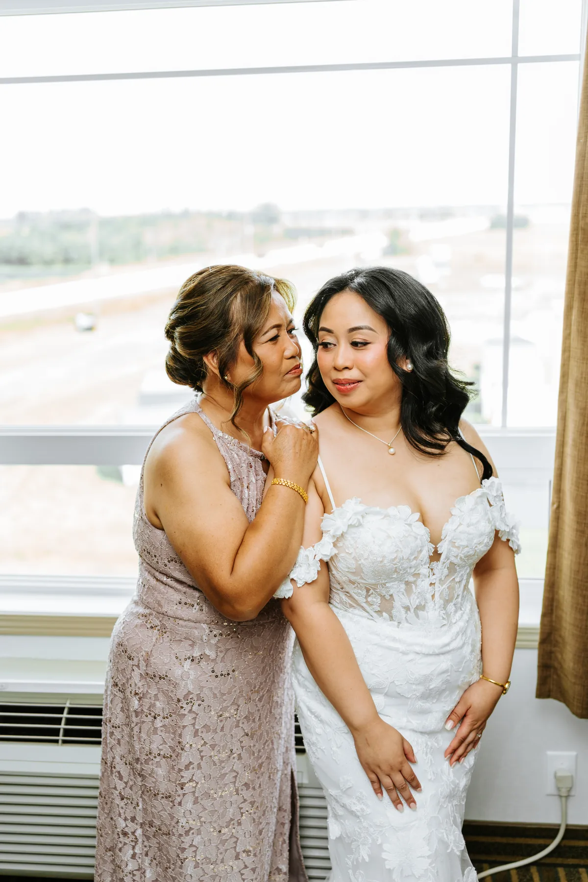 Jay with her mother at the window getting ready — Hawthorne Estates wedding, Manitoba