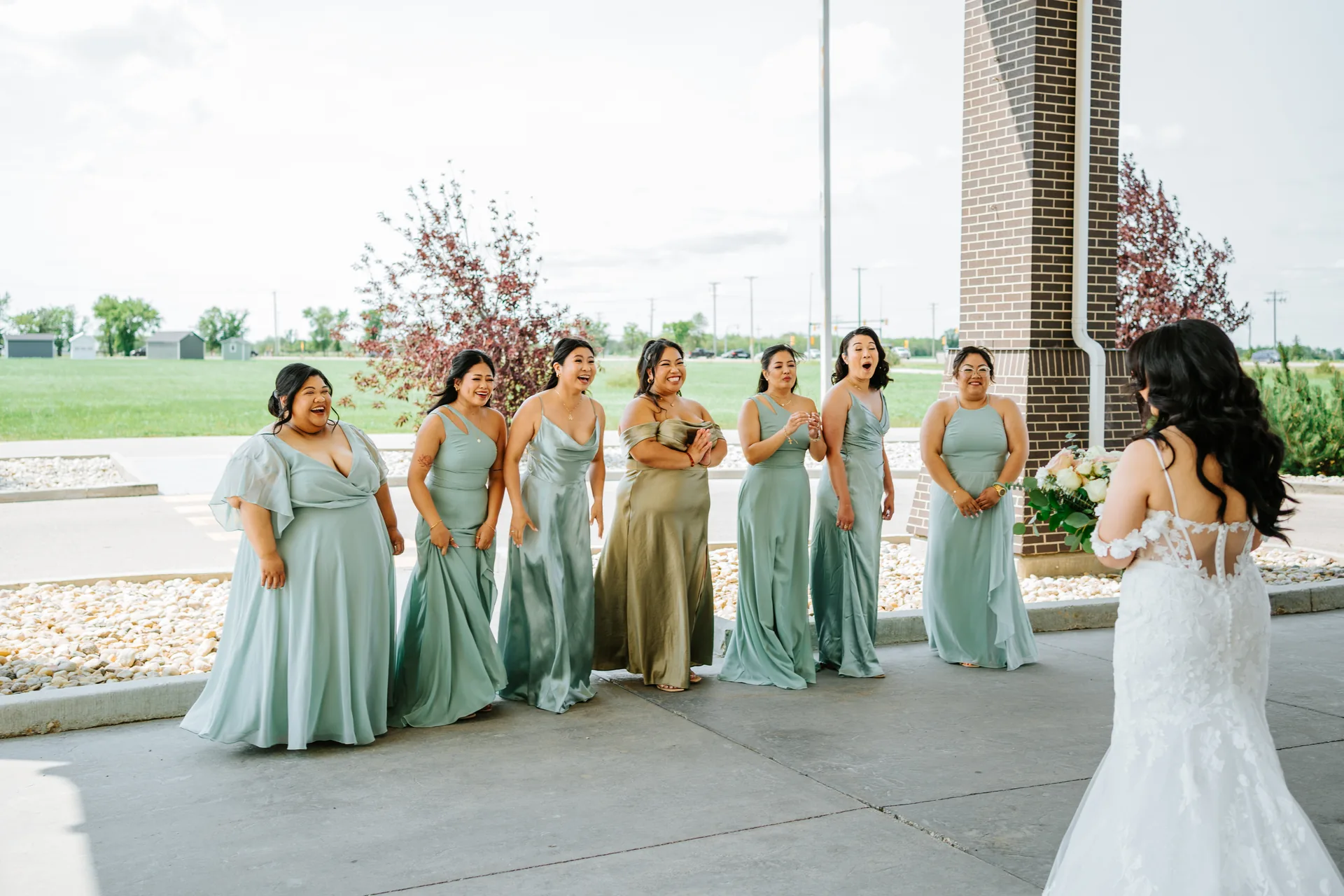 Bridesmaids' first look reaction seeing Jay in her wedding dress — Hawthorne Estates wedding, Manitoba