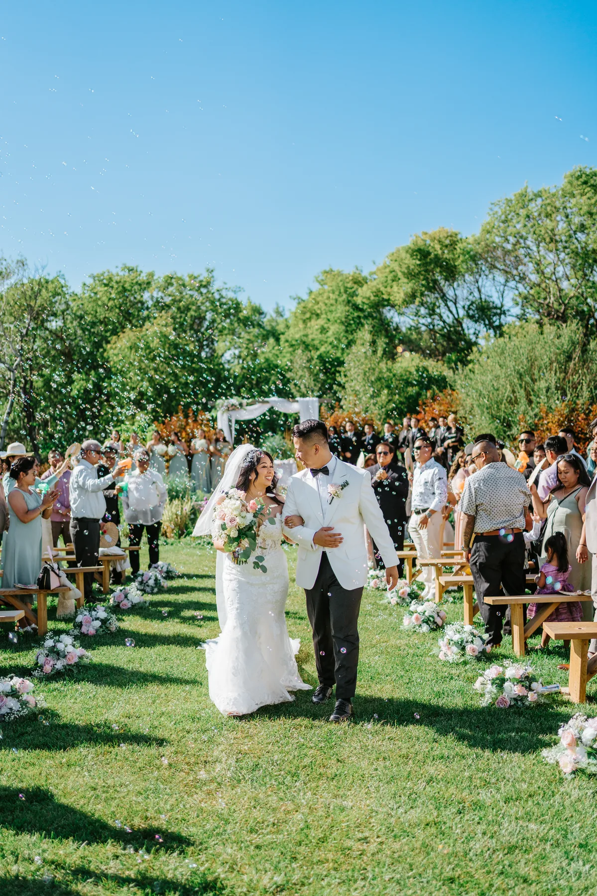Jay and Mark recessional confetti celebration at Hawthorne Estates East Selkirk Manitoba — Ngo Photography