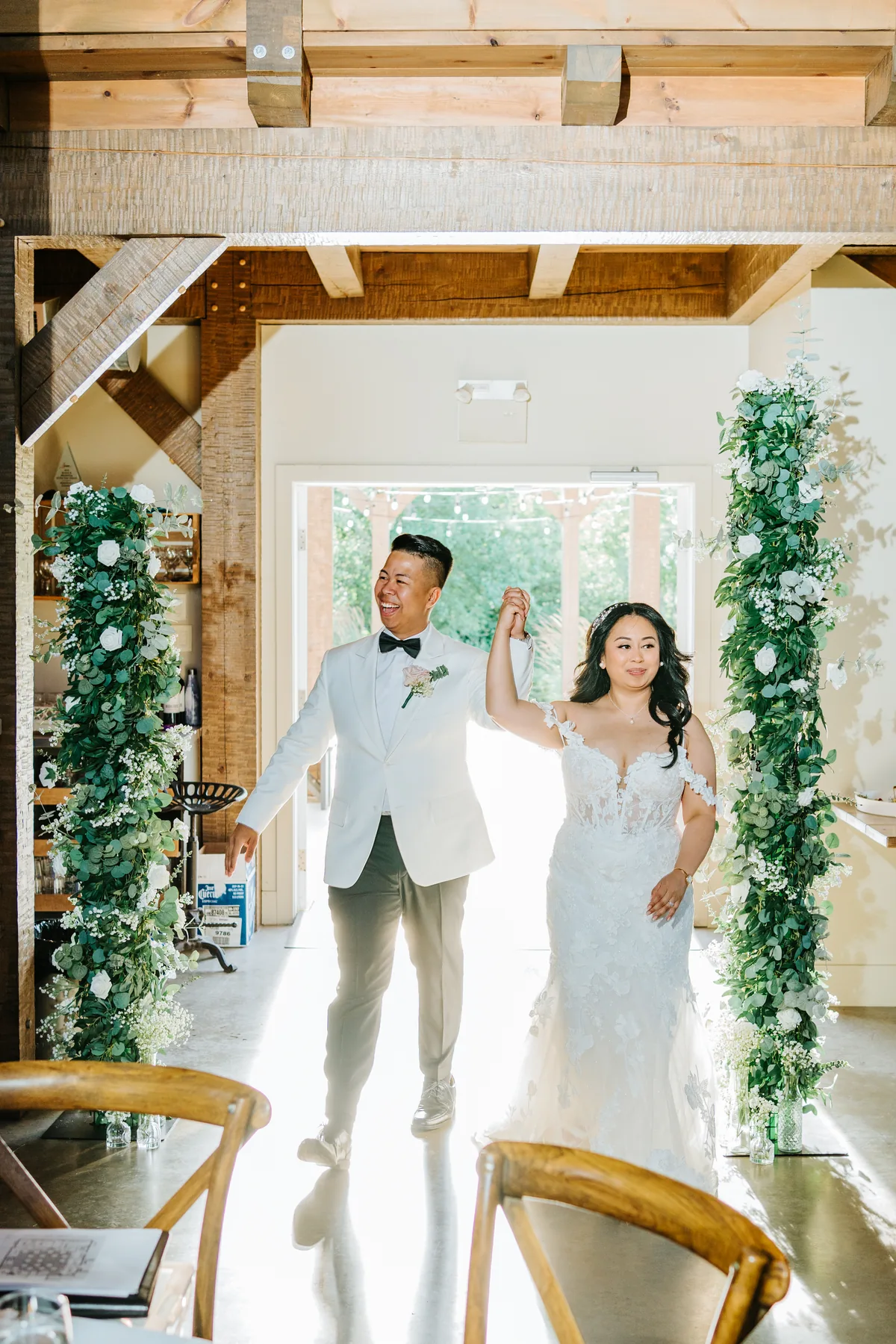 Jay and Mark romantic portrait against the vine-covered pergola at Hawthorne Estates, Manitoba