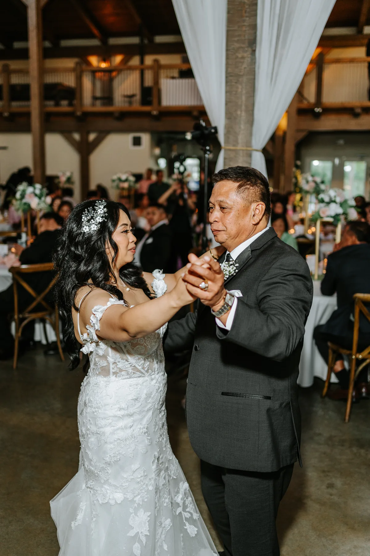 Colour frame of Jay's father-daughter dance in the Hawthorne Estates barn reception, Manitoba